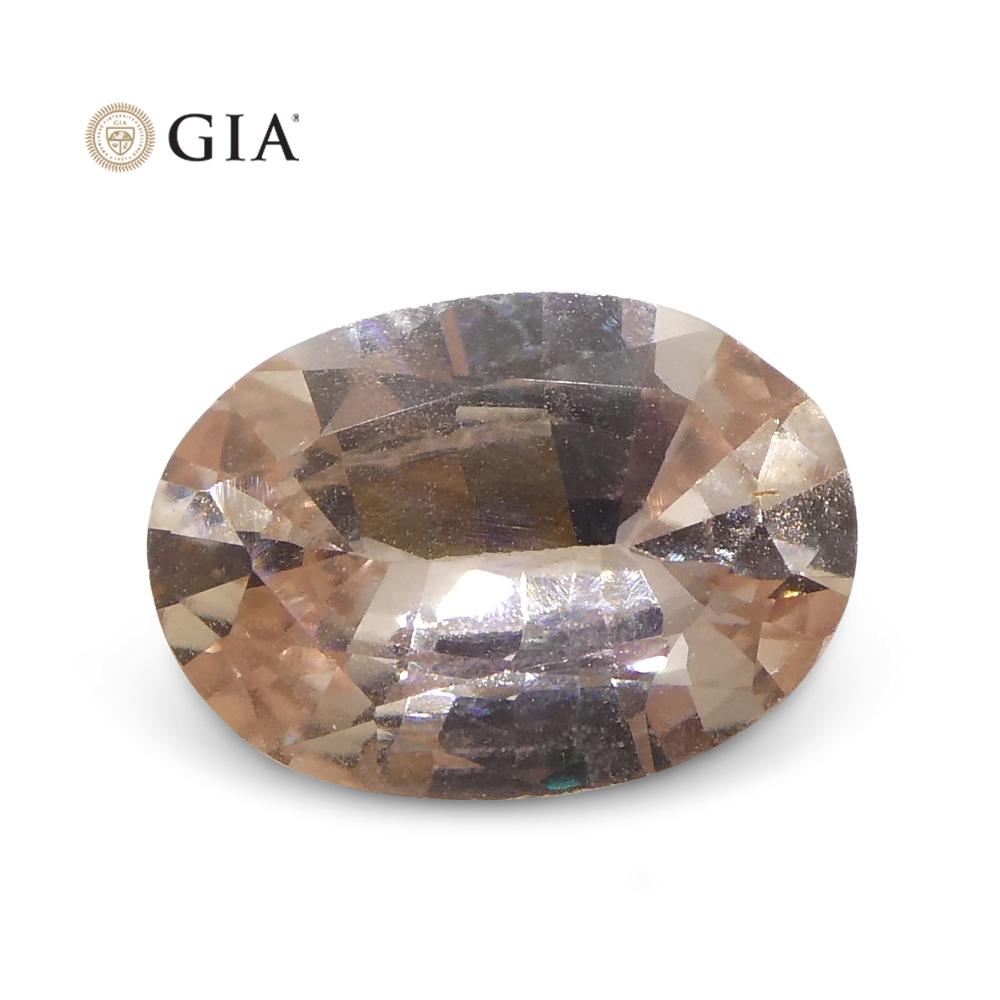 0.77 Carat Oval Orangy Pink Padparadscha Sapphire GIA Certified East Africa For Sale 1