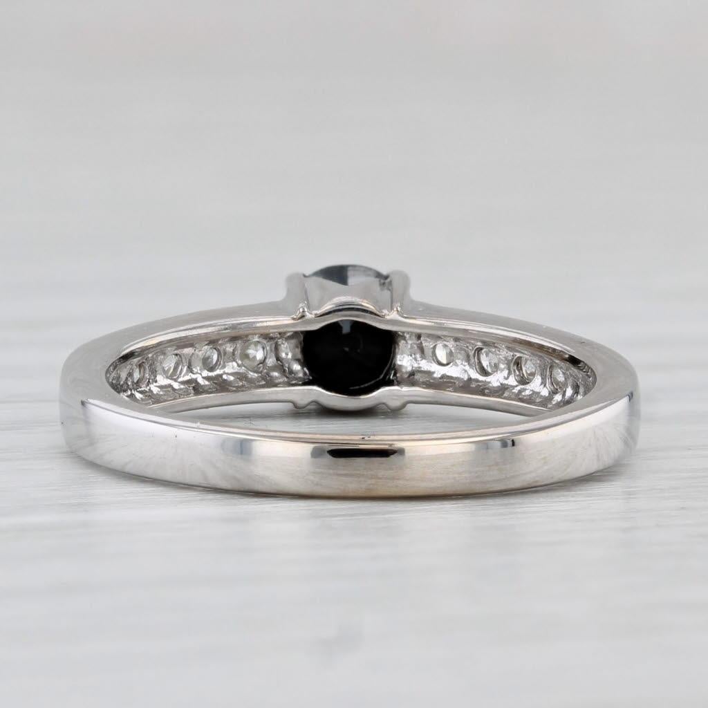 Gemstone Information:
- Natural Diamond -
Carats - 0.59ct
Cut - Round Brilliant
Color - Treated Black

- Natural Diamonds -
Total Carats - 0.18ctw
Cut - Round Brilliant
Color - G - I
Clarity - I2 - I3

Metal: 18k White Gold
Weight: 4.1 Grams