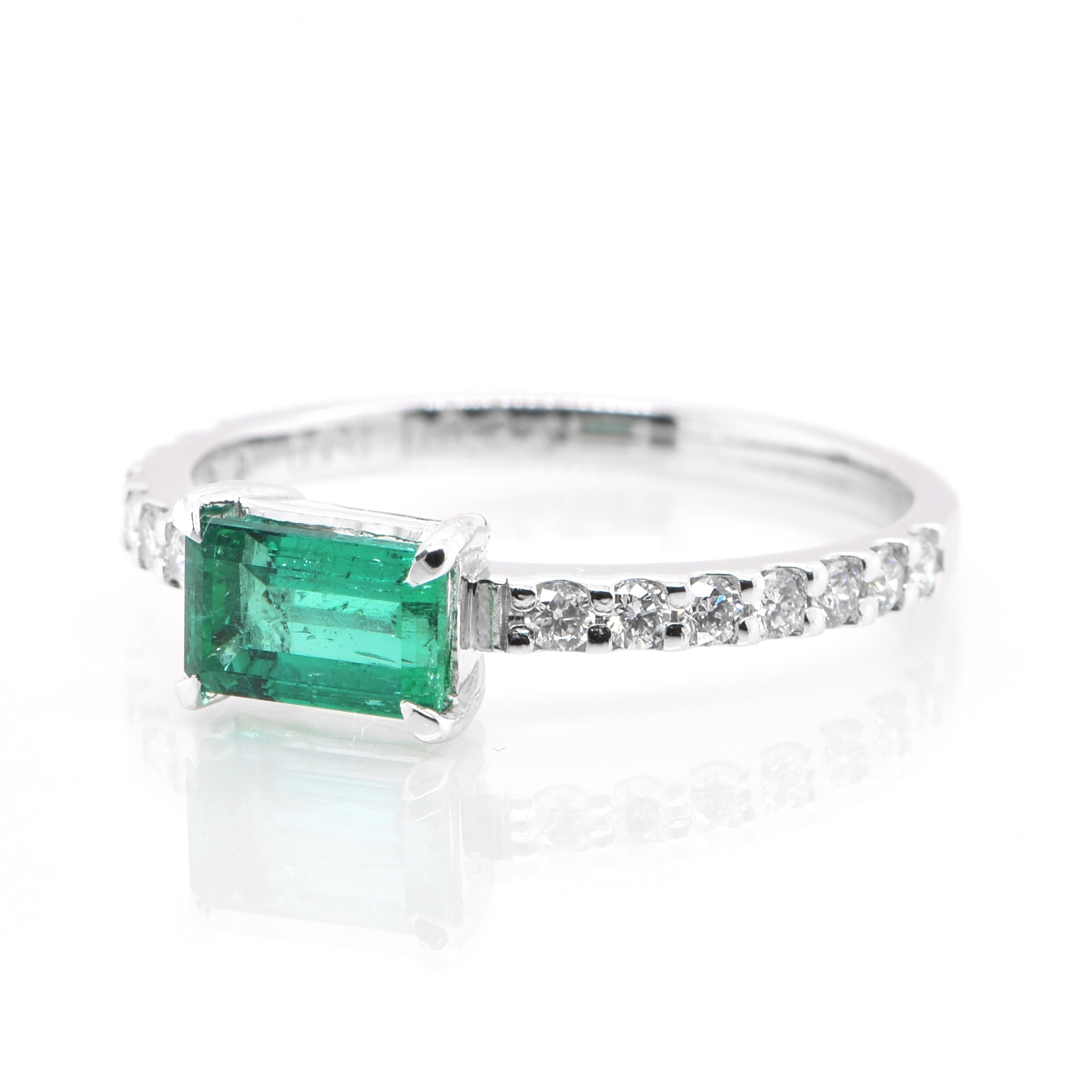 A stunning Ring featuring a 0.78 Carat, Natural, Emerald and 0.25 Carats of Diamond Accents set in Platinum. The Emerald displays very good color and clarity which is rare for most Emeralds set in jewelry! The ring is great for everyday use as well