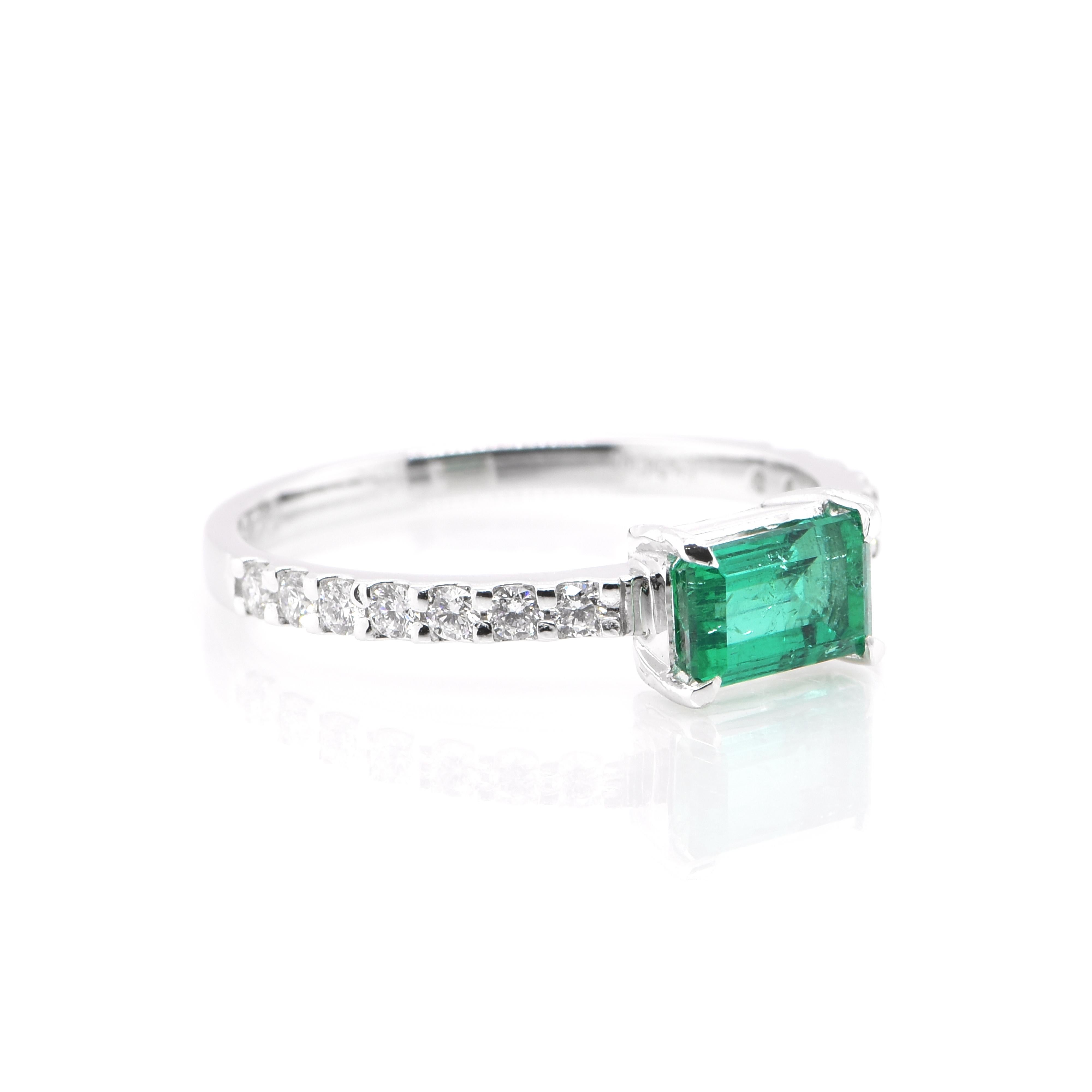 Modern 0.78 Carat, Natural, Emerald and Diamond Engagement Ring Set in Platinum