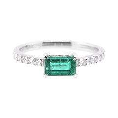 0.78 Carat, Natural, Emerald and Diamond Engagement Ring Set in Platinum