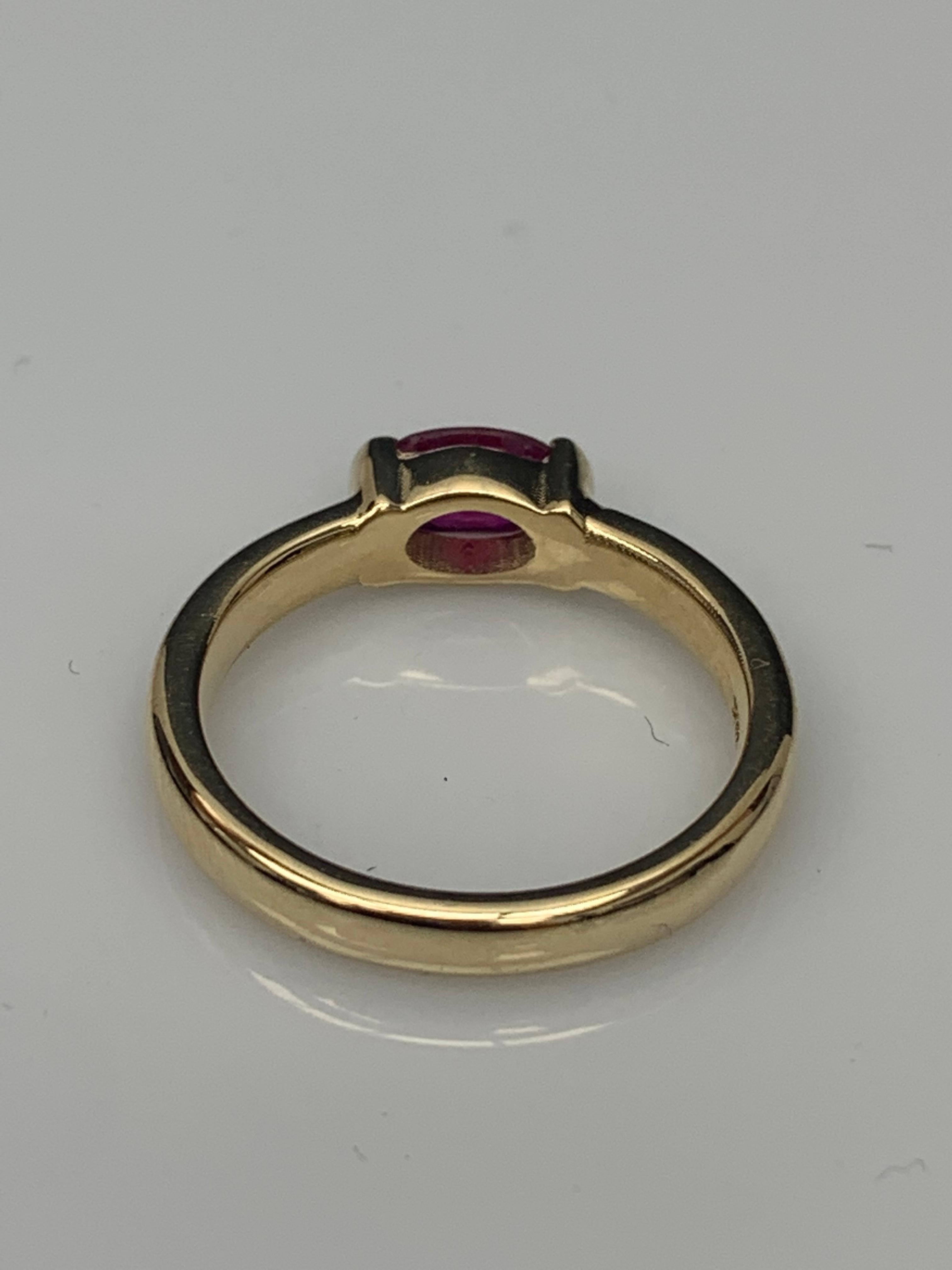 0.78 Carat Oval Cut Ruby Band Ring in 14K Yellow Gold For Sale 8
