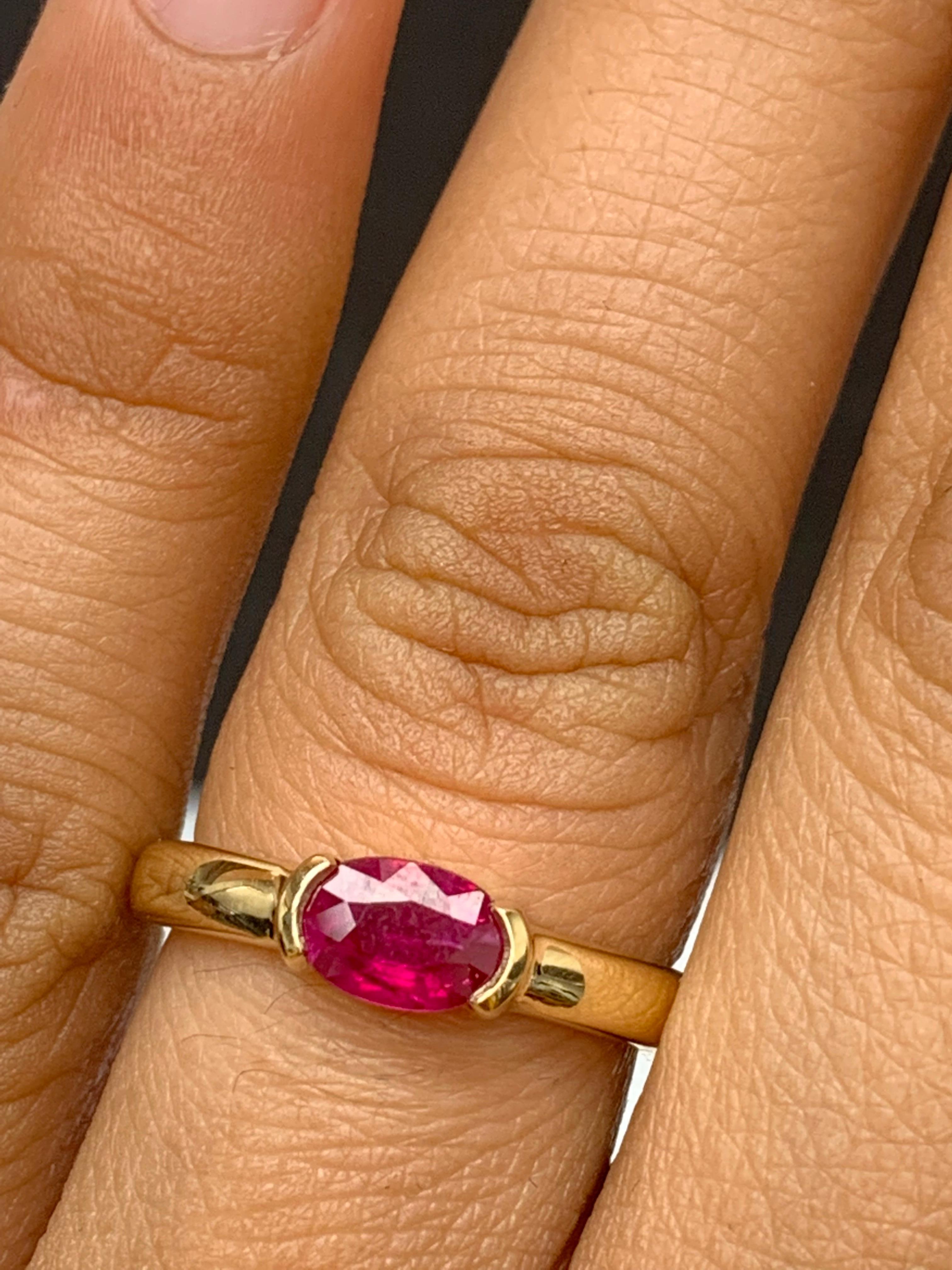 Women's 0.78 Carat Oval Cut Ruby Band Ring in 14K Yellow Gold For Sale