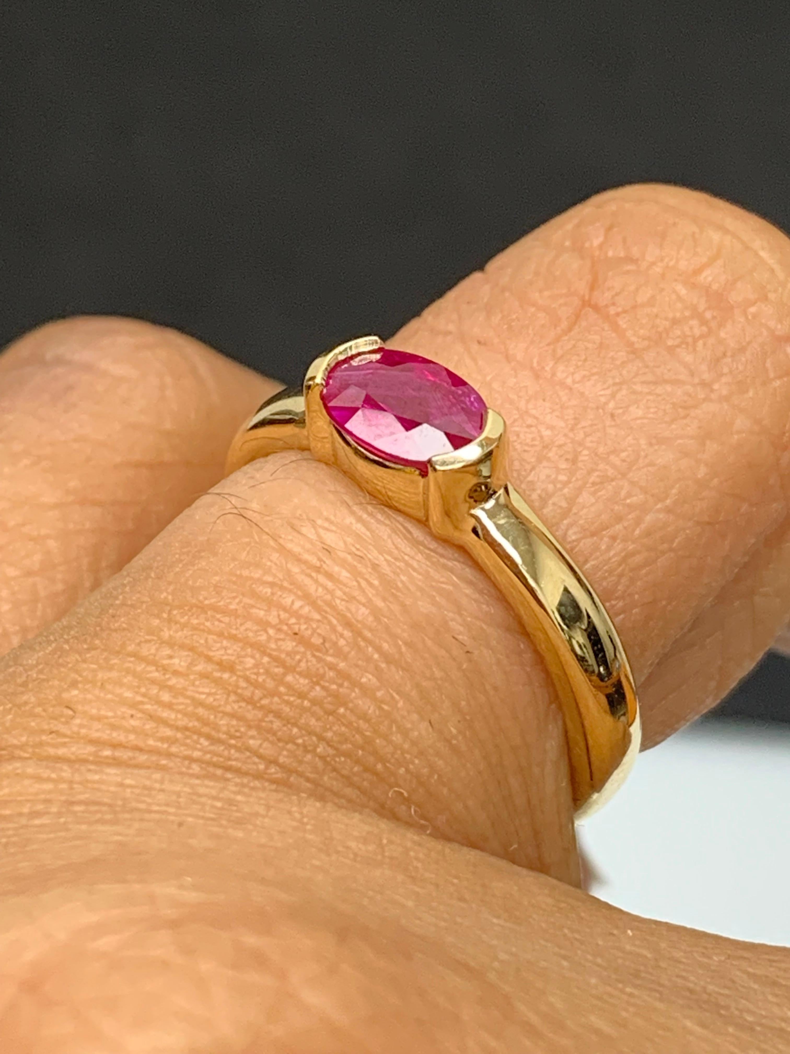 0.78 Carat Oval Cut Ruby Band Ring in 14K Yellow Gold For Sale 2