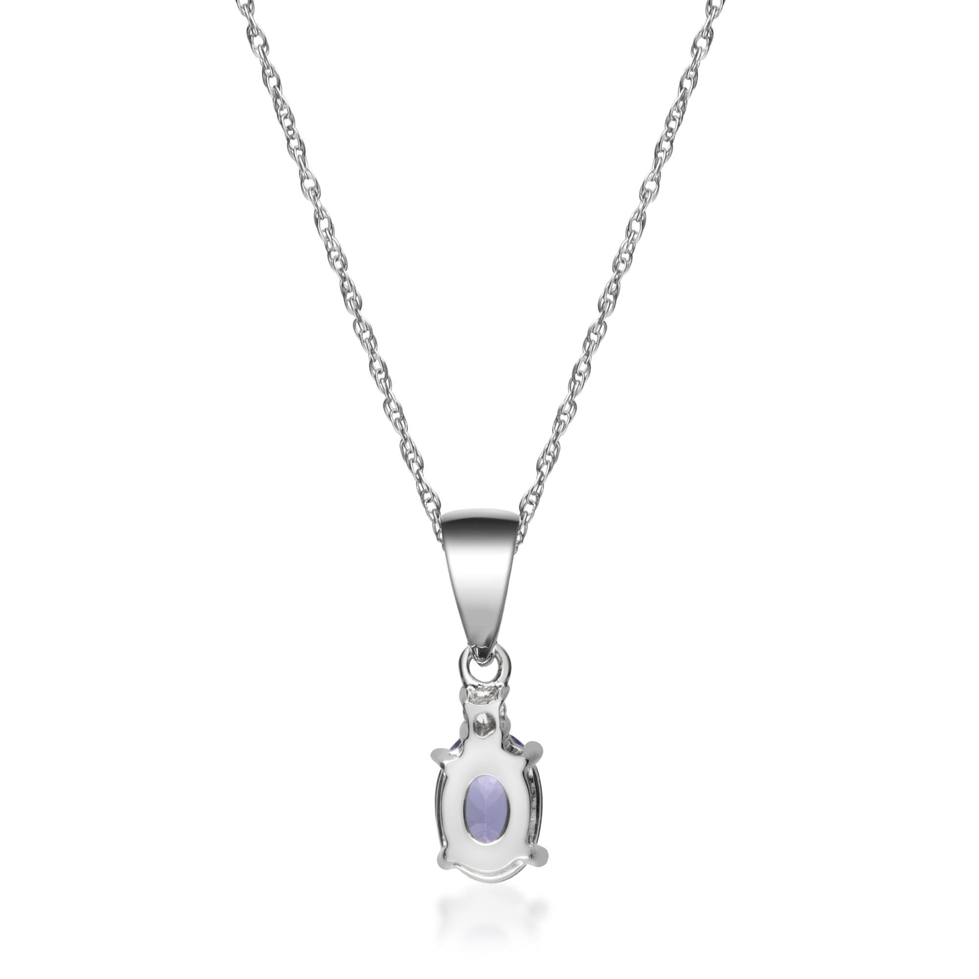 Taglio ovale Ciondolo in oro bianco 10 carati con accenti di diamanti di tanzanite taglio ovale da 0,78 carati in vendita