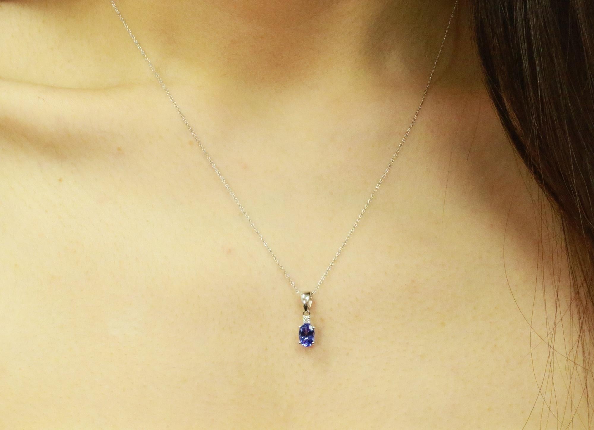 Decorate yourself in elegance with this Pendant is crafted from 10-karat White Gold by Gin & Grace Pendant. This Pendant is made up of 5X7 Oval-Cut Prong setting Genuine Tanzanite (1 Pcs) 0.78 Carat and Round-Cut Prong setting Natural White Diamond