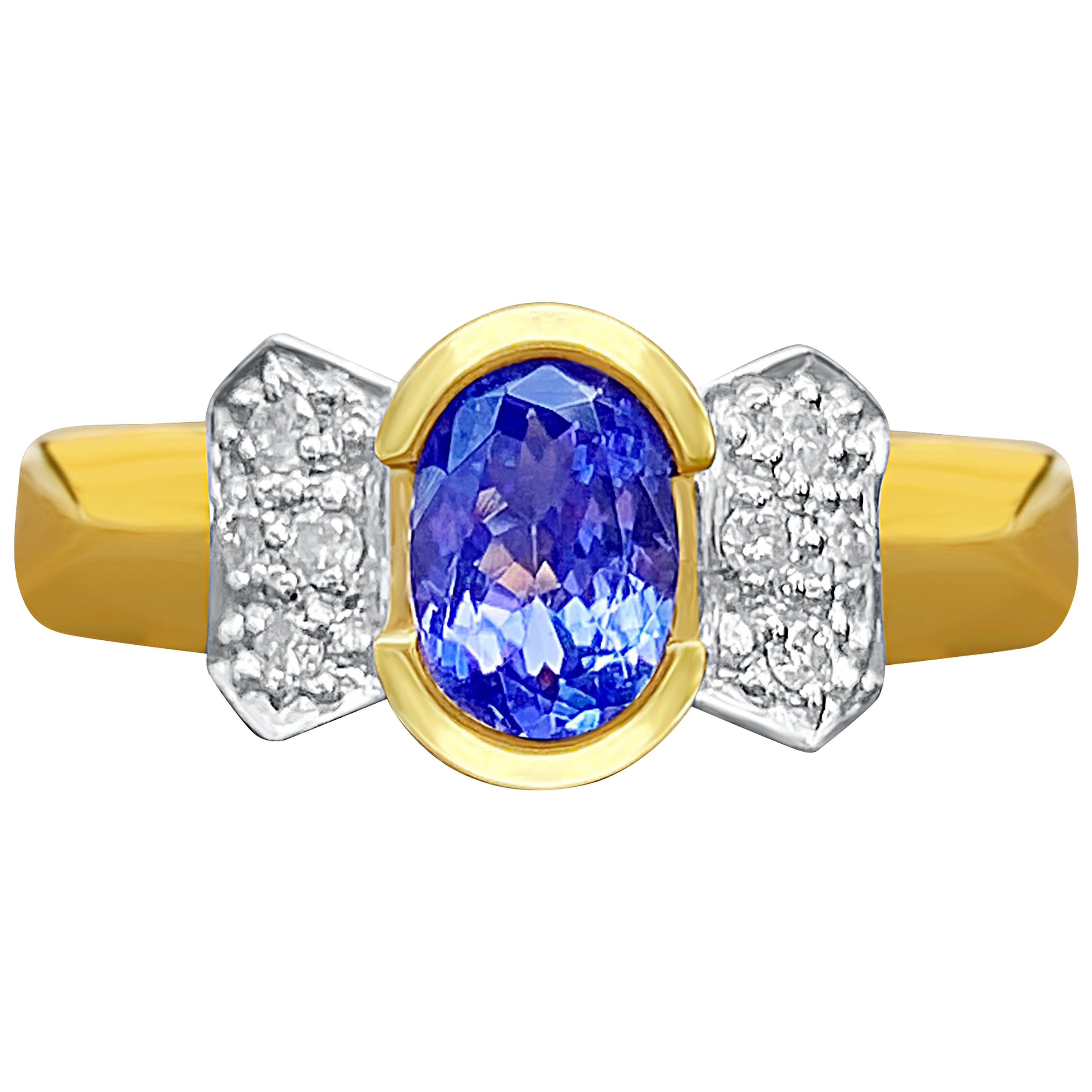 0.78 Carat Oval-Cut Tanzanite, Diamond and 14K Yellow Gold Engagement Ring For Sale