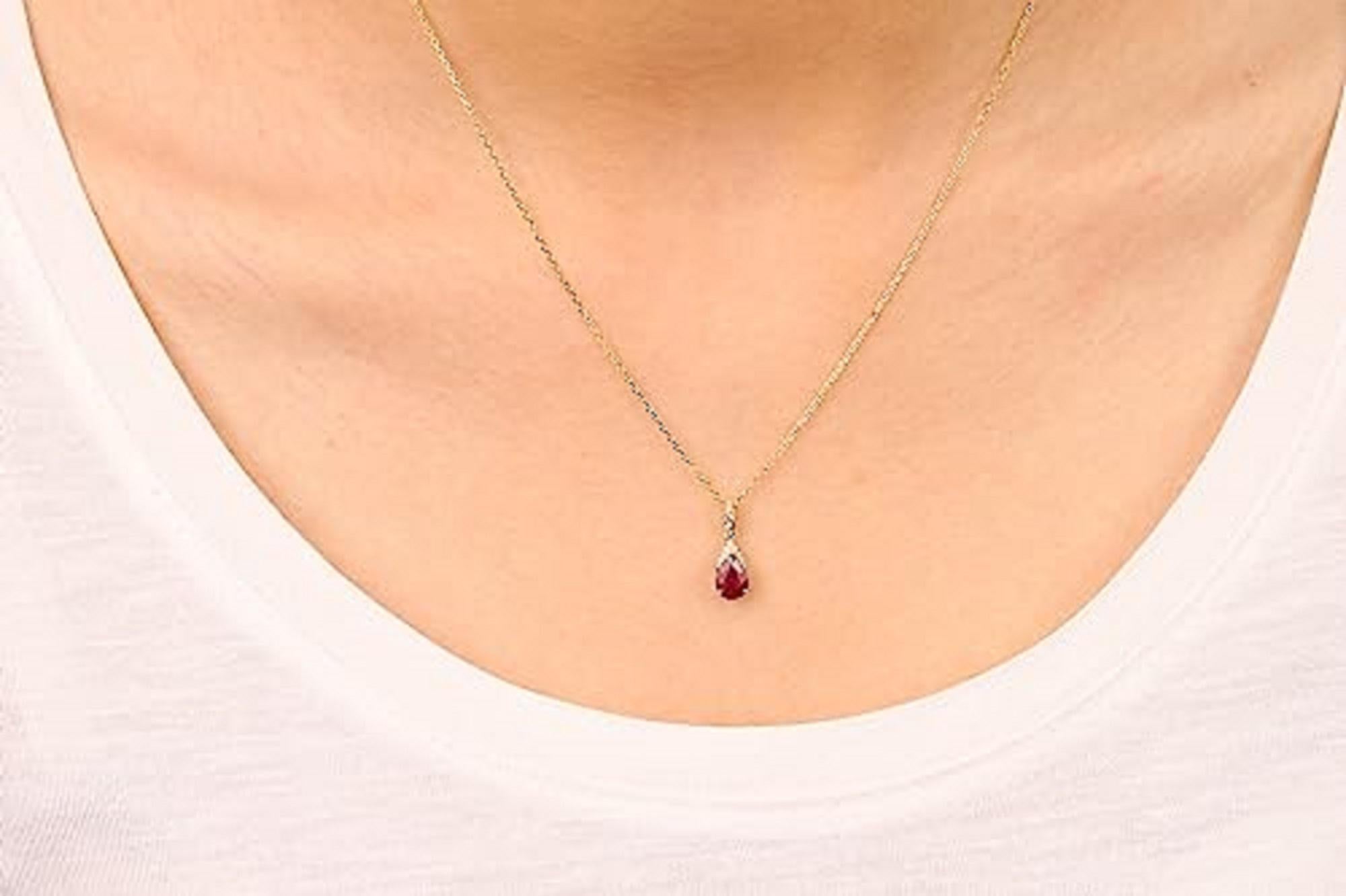 Decorate yourself in elegance with this Pendant is crafted from 10-karat Yellow Gold by Gin & Grace. This Pendant is made up of 7x5 Pear-Cut Ruby (1 pcs) 0.78 carat and Round-cut White Diamond (10 Pcs) 0.04 Carat. This Pendant is weight 1.73 grams.