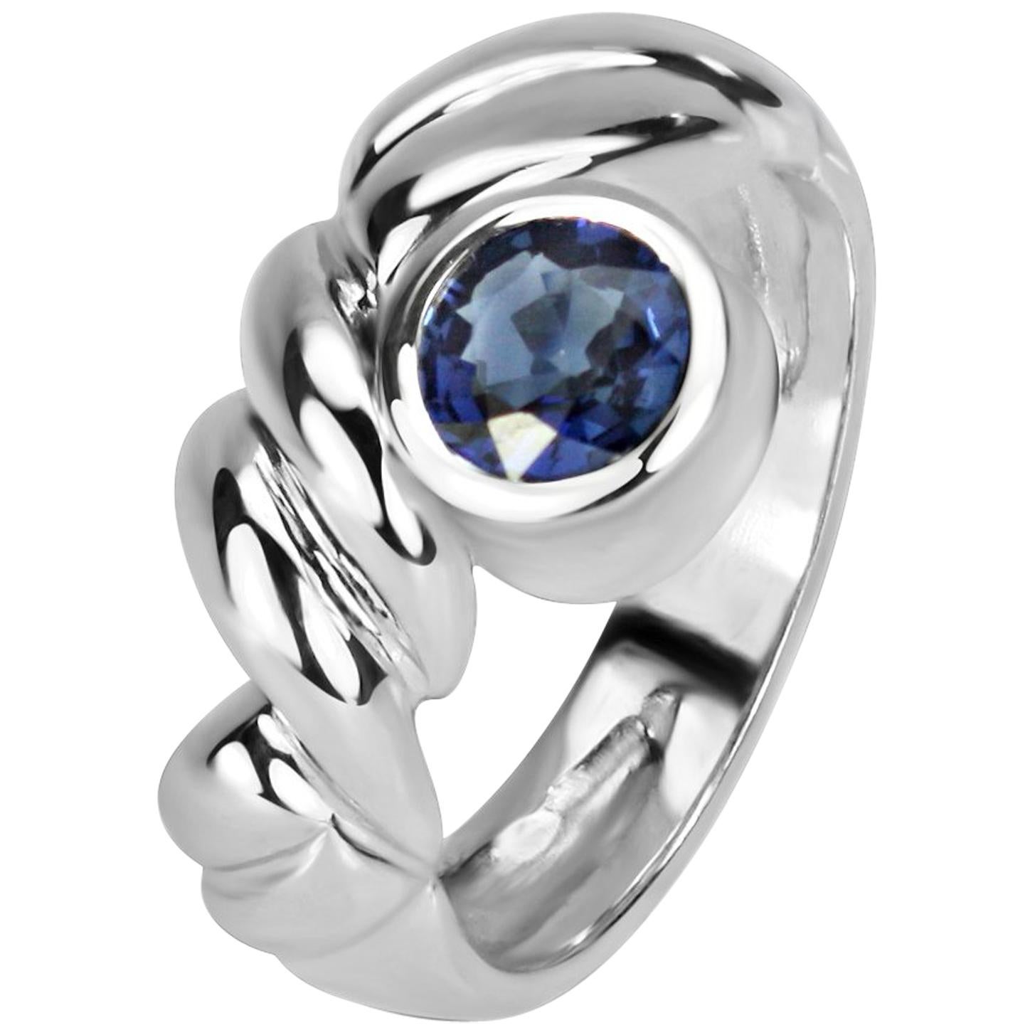 0.78 Carat Round Blue Sapphire in 18 Karat Gold Inverted Collet with Carved Band For Sale