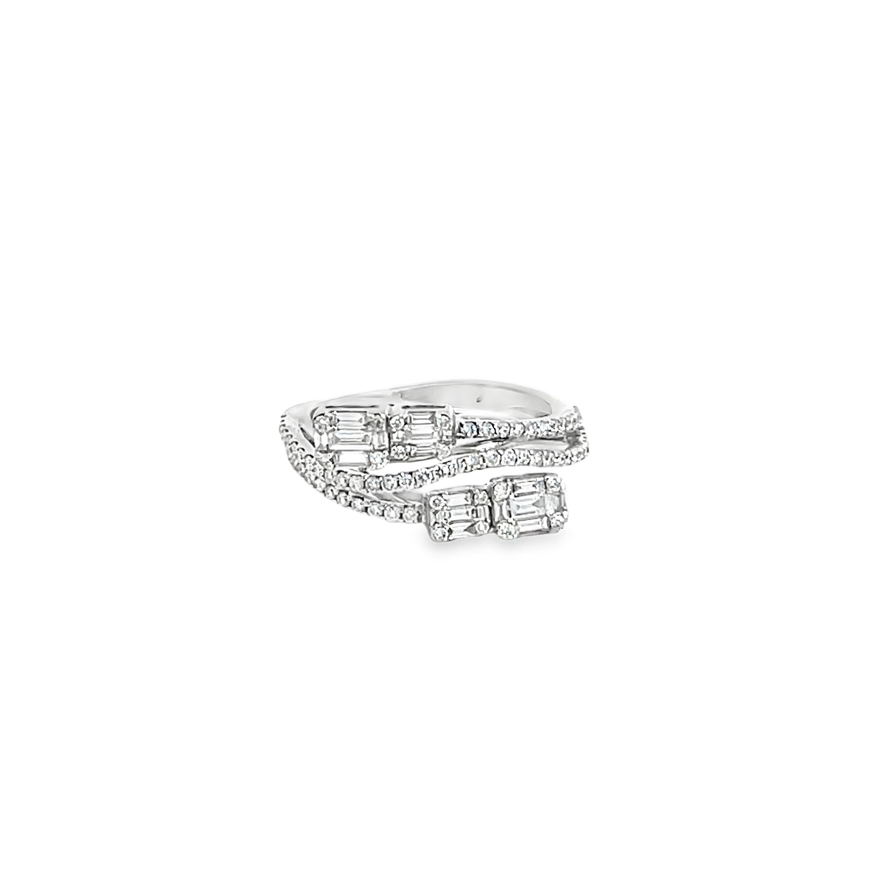 This Diamond Ring is a stunning and timeless accessory that can add a touch of glamour and sophistication to any outfit. This ring contains 0.79 Carats of  Round and Baguette White Diamonds set in 18K White Gold. Ring Size is 6 1/2


