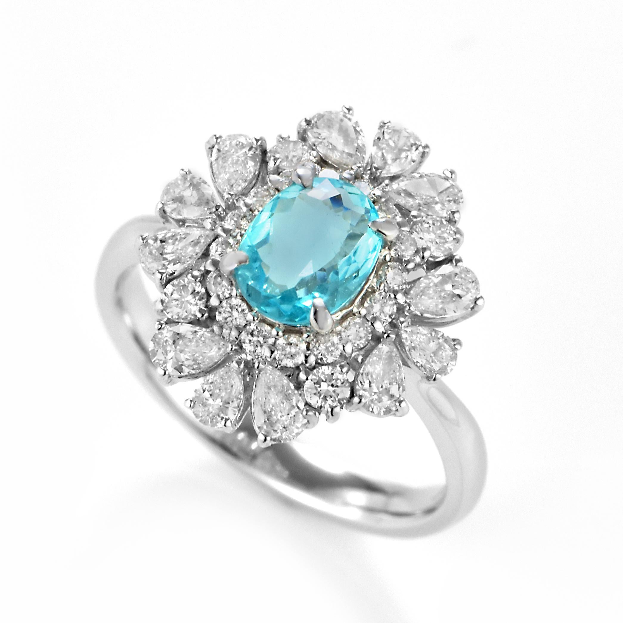 A beautiful ring featuring a 0.79 Carat Natural Paraiba Tourmaline and 1.04 Carats of Diamond Accents made in Platinum. Paraiba Tourmalines were only discovered 30 years ago in the Brazilian state of the same name- Paraiba. Since then they have