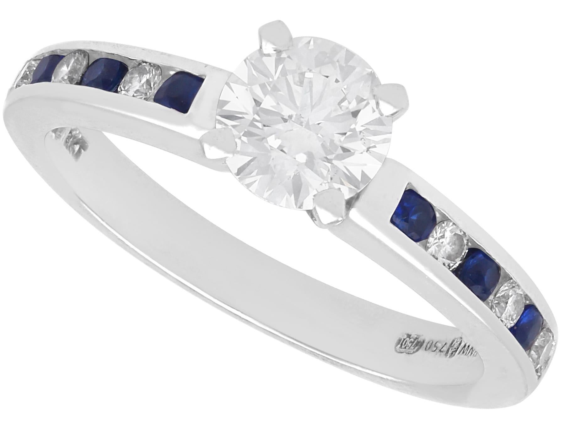 0.79 Carat Diamond 0.14 Carat Sapphire 18k White Gold Solitaire Ring Circa 2000 For Sale