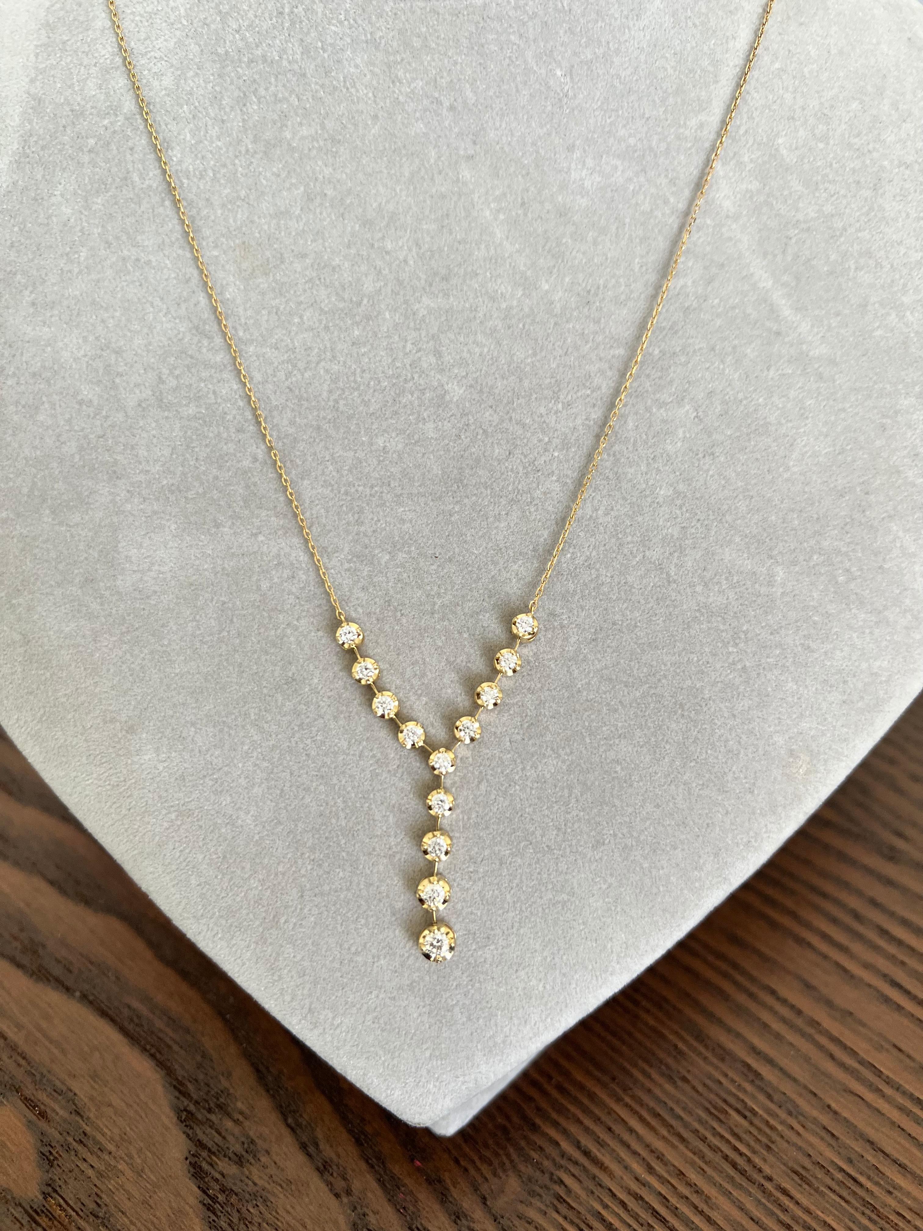 This chain necklace has 13 Natural Round Cut Diamonds that weigh 0.79 carats. The clarity and color of the necklace are SI-F.

The approximate weight of this necklace is 4.2 grams and is set in 14 Karat Yellow Gold

The necklace is 16.5 inches long. 