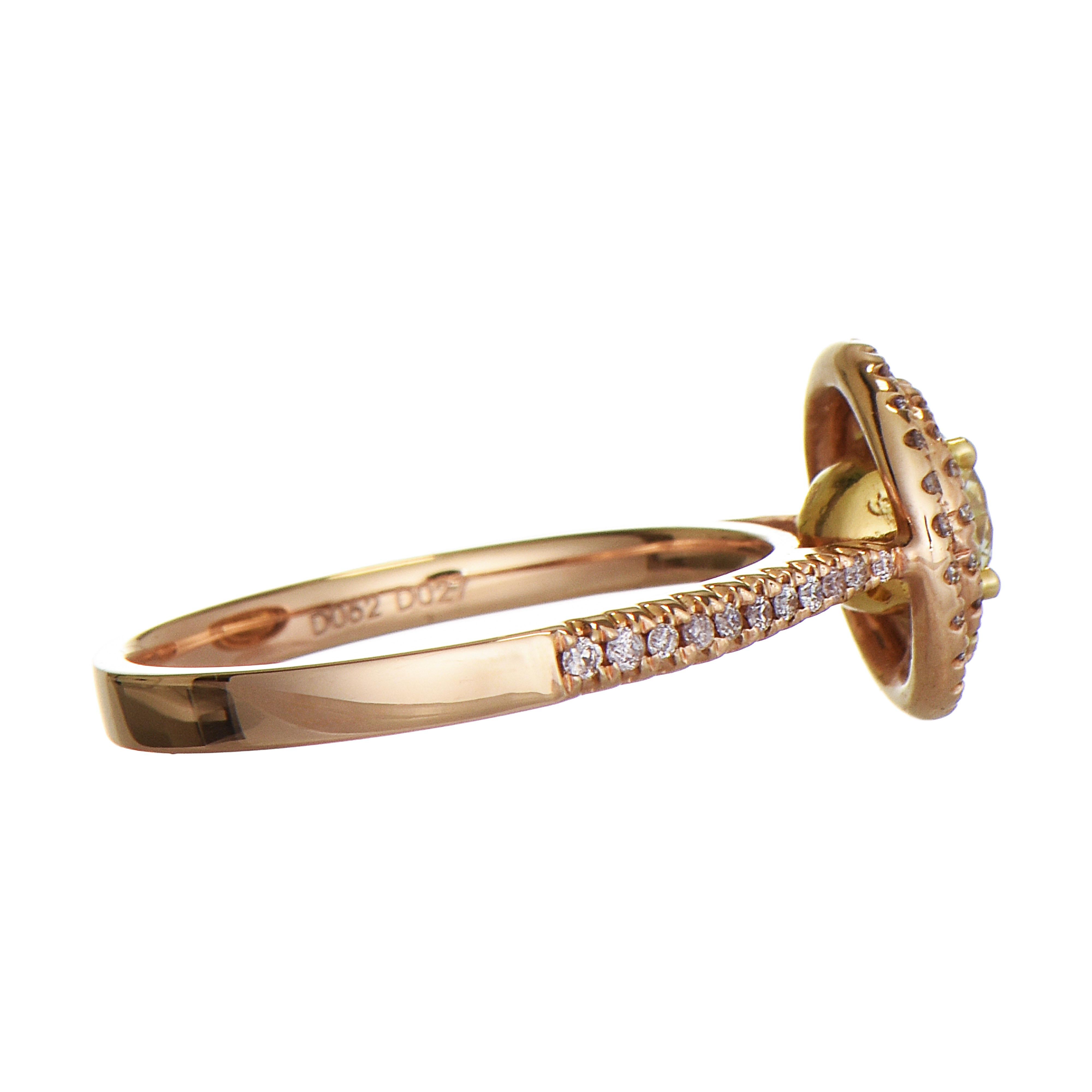 This beautiful ring features a light yellow diamond in the center, set in yellow gold, surrounded by a double halo of light pink diamonds, with a band embellished also with light pink diamonds, all set in rose gold.

68 Light Pink Diamonds: 0.27