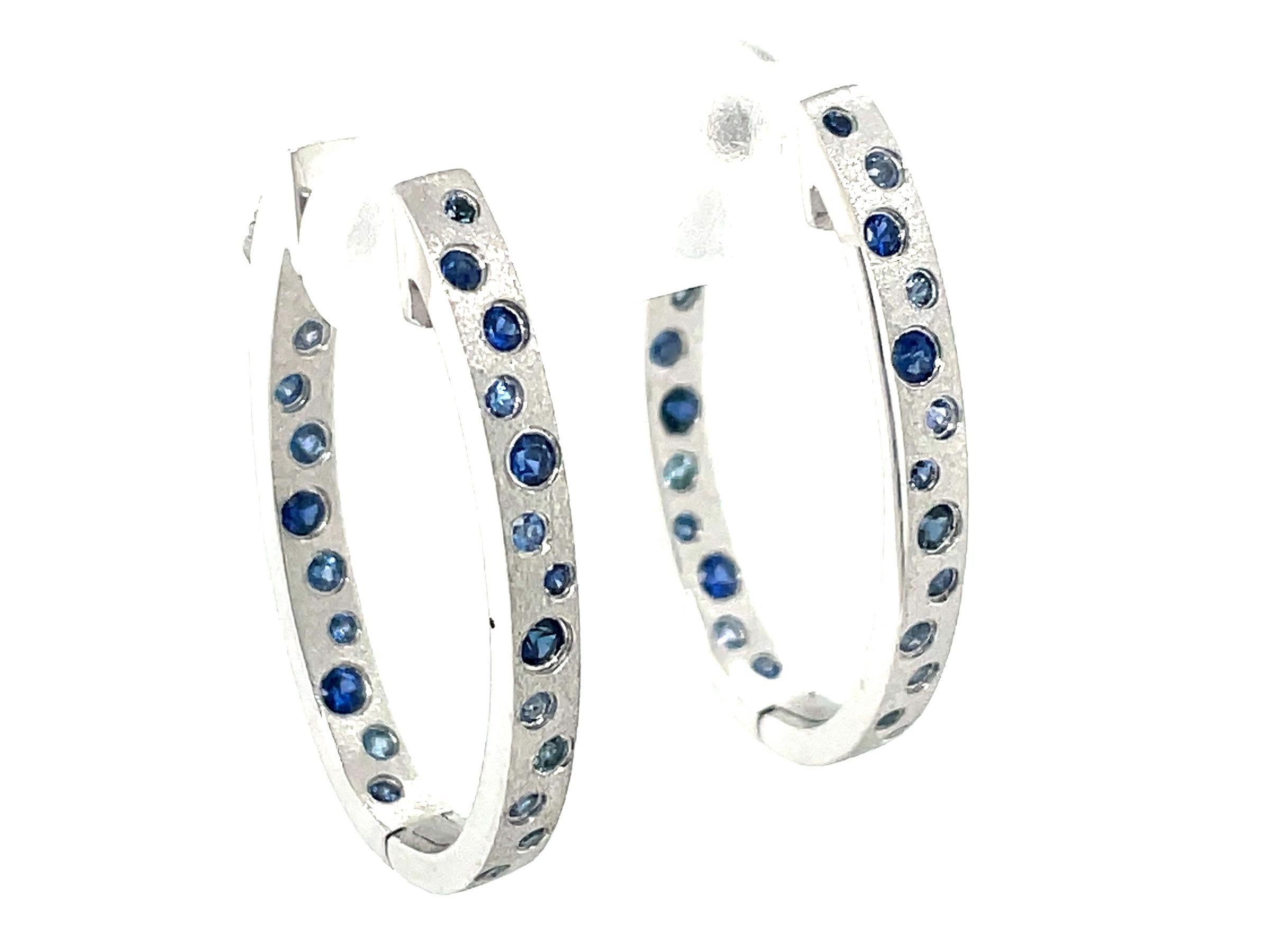 Round Cut 0.79 Carat Sapphire Flush Set Oval Hoop White Gold Earrings For Sale