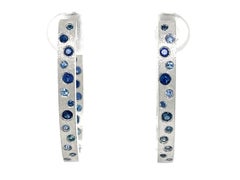 0.79 Carat Sapphire Flush Set Oval Hoop White Gold Earrings