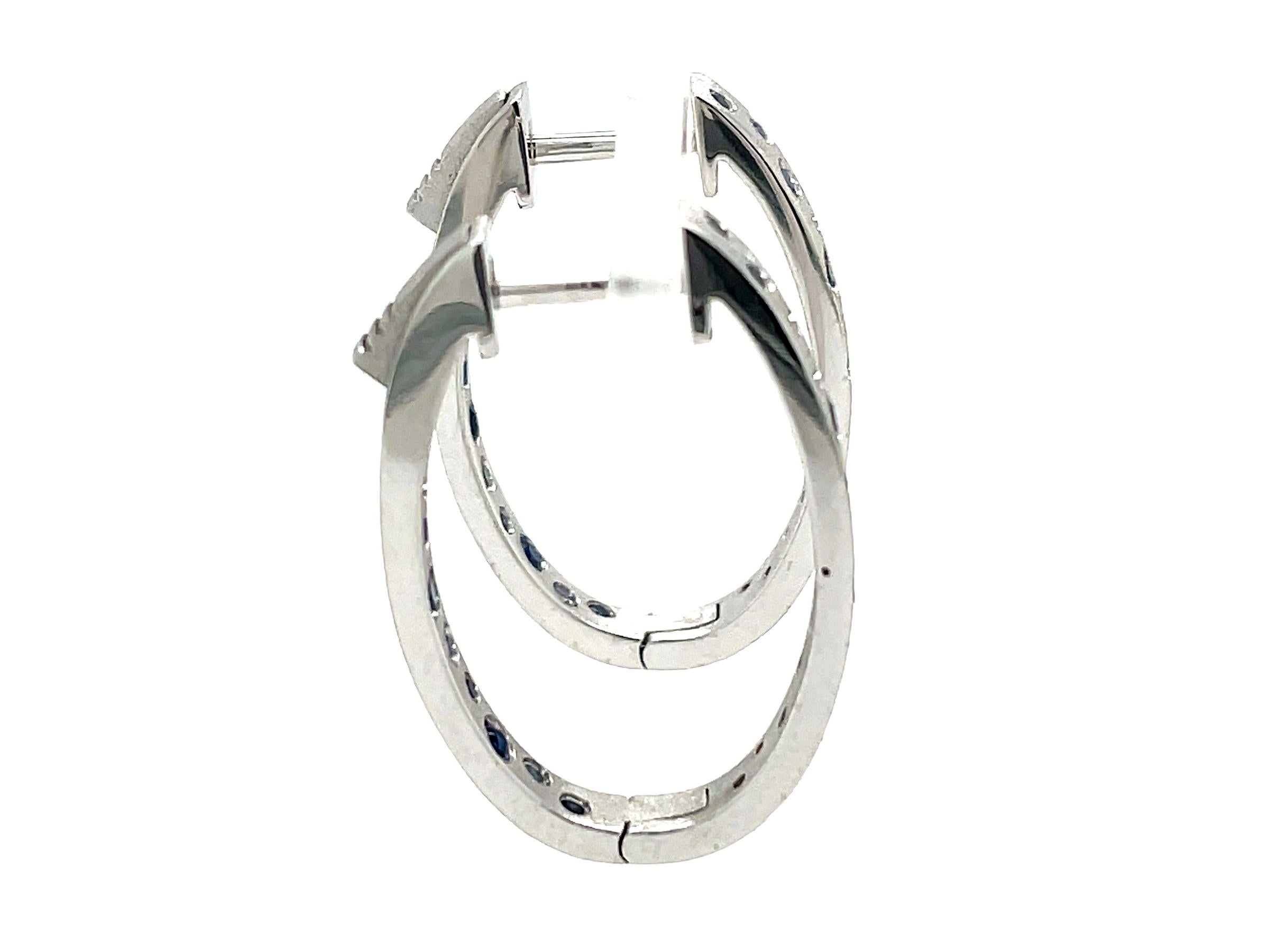 0.79 Carat Sapphire Flush Set Oval Hoop White Gold Earrings In New Condition For Sale In Great Neck, NY
