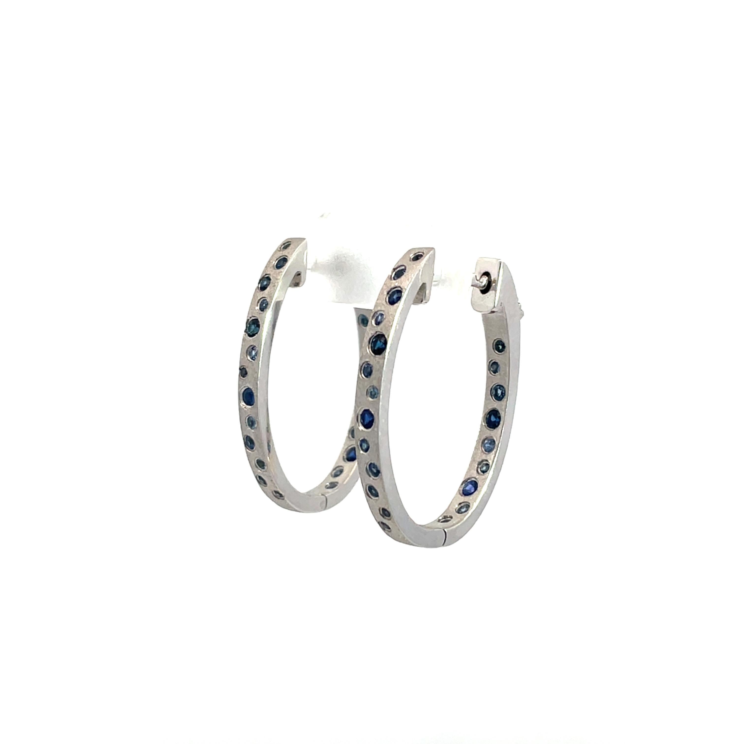 0.79 Carat Sapphire Flush Set Oval Hoop White Gold Earrings For Sale 2