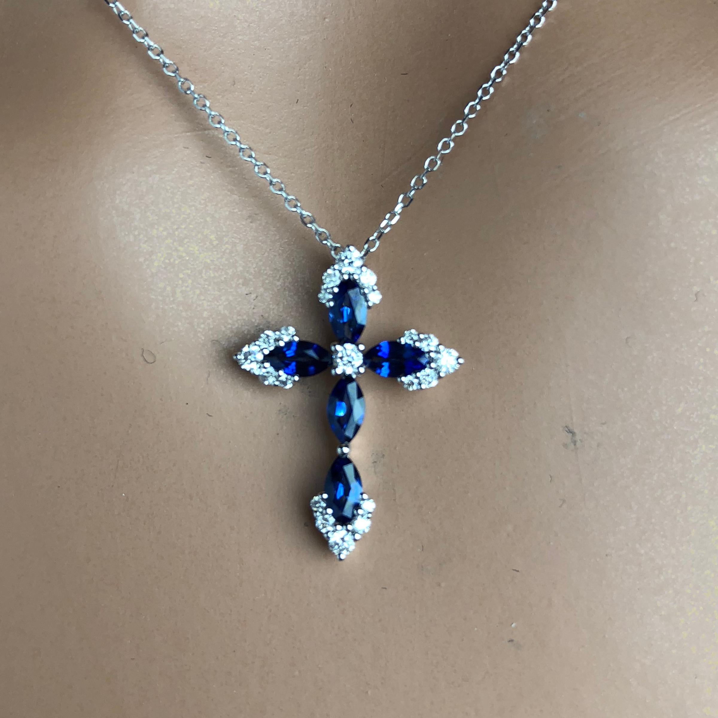 Contemporary 0.79 Carat Vivid Blue Sapphire and 0.23 Carat Diamond Cross Pendant