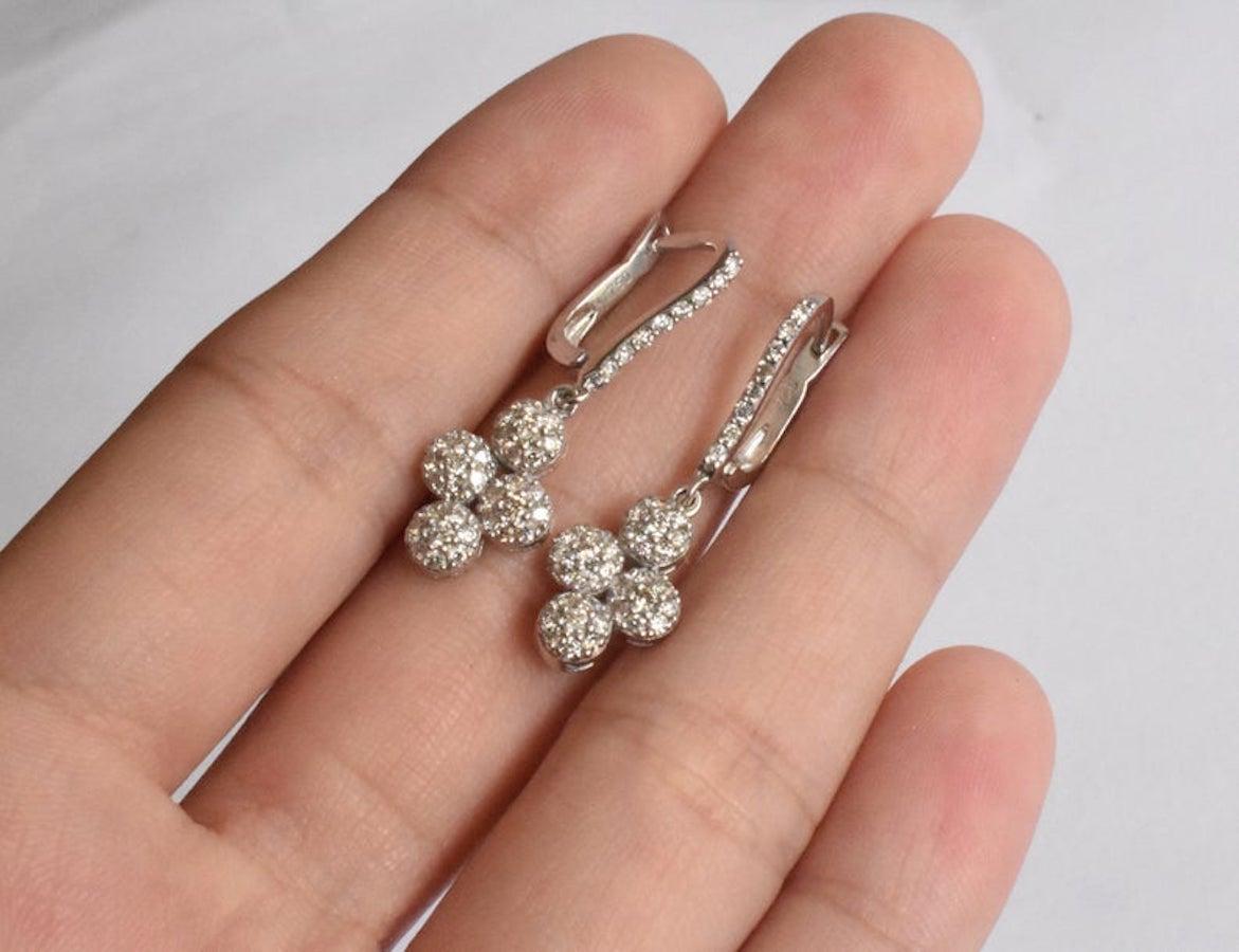 Stunning Sparkly Earrings With Natural Round Diamonds with color H and Clarity SI handset on 18k Gold in a classic handmade design by a master setter of Oshi Jewels. Great as a gift to yourself or a loved one.


