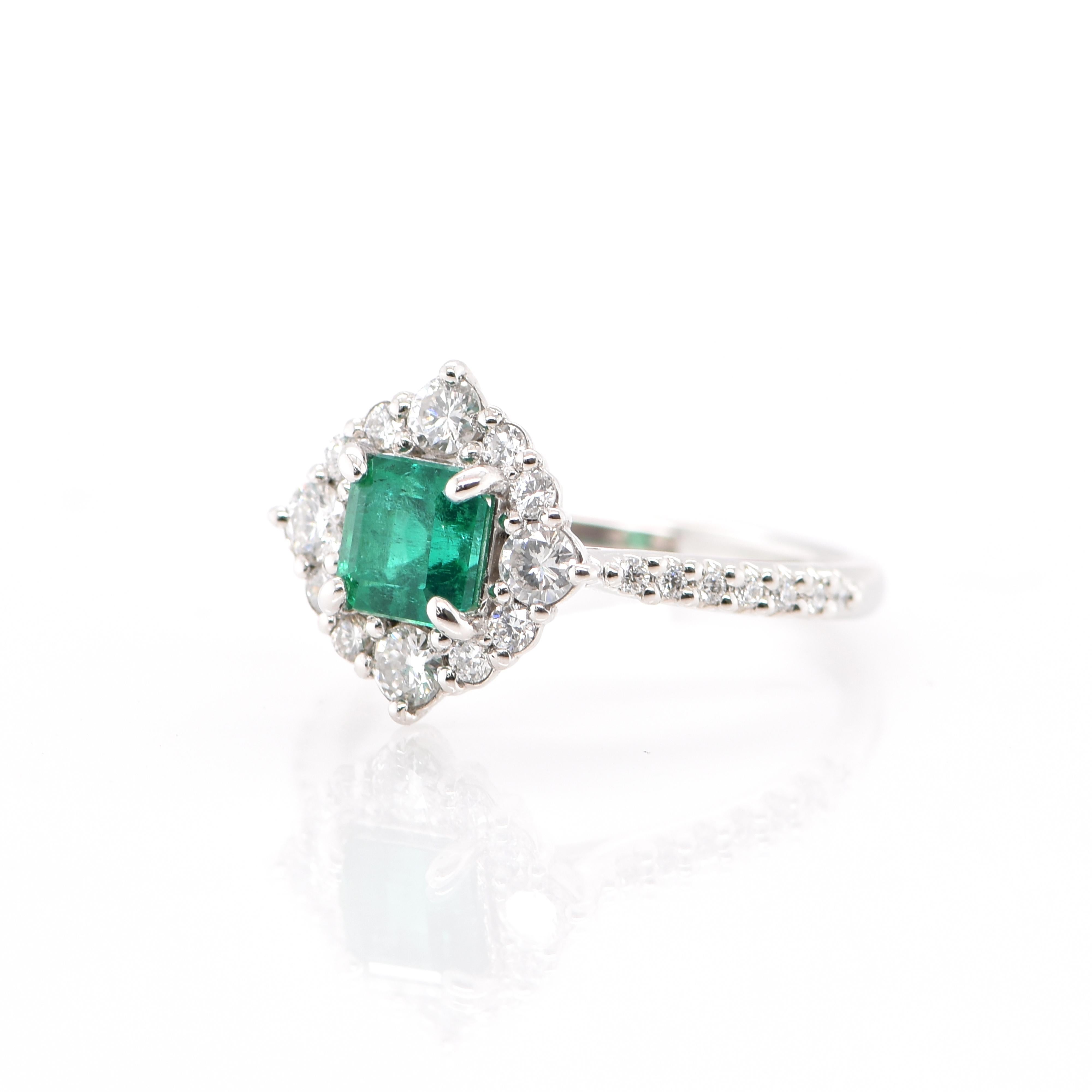 A stunning Halo Engagement Ring featuring a 0.797 Carat Natural Emerald and 0.45 Carats of Diamond Accents set in Platinum. People have admired emerald’s green for thousands of years. Emeralds have always been associated with the lushest landscapes