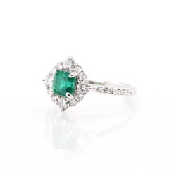0.797 Carat Natural Emerald and Diamond Halo Ring Set in Platinum