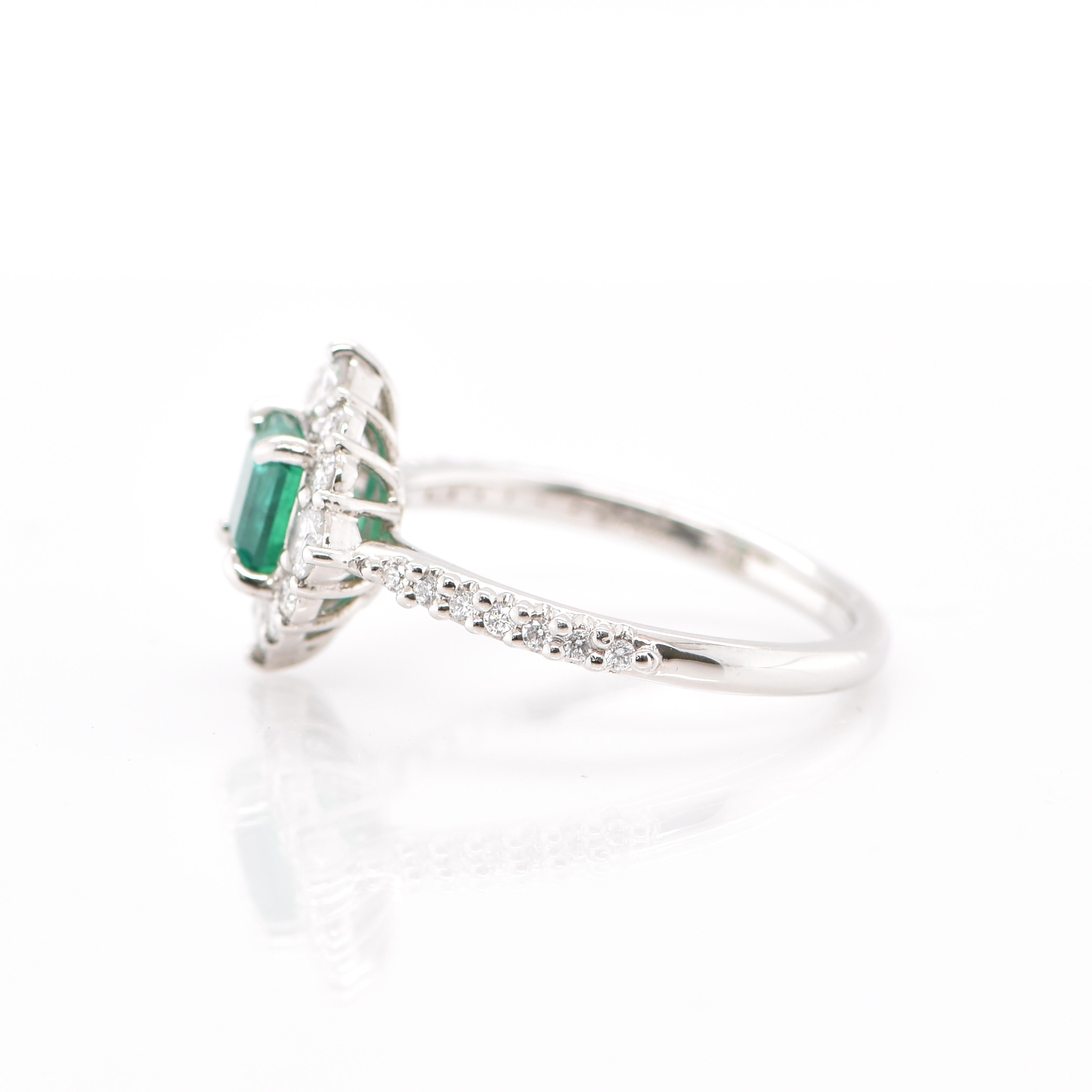 Emerald Cut 0.797 Carat Natural Emerald and Diamond Halo Ring Set in Platinum For Sale