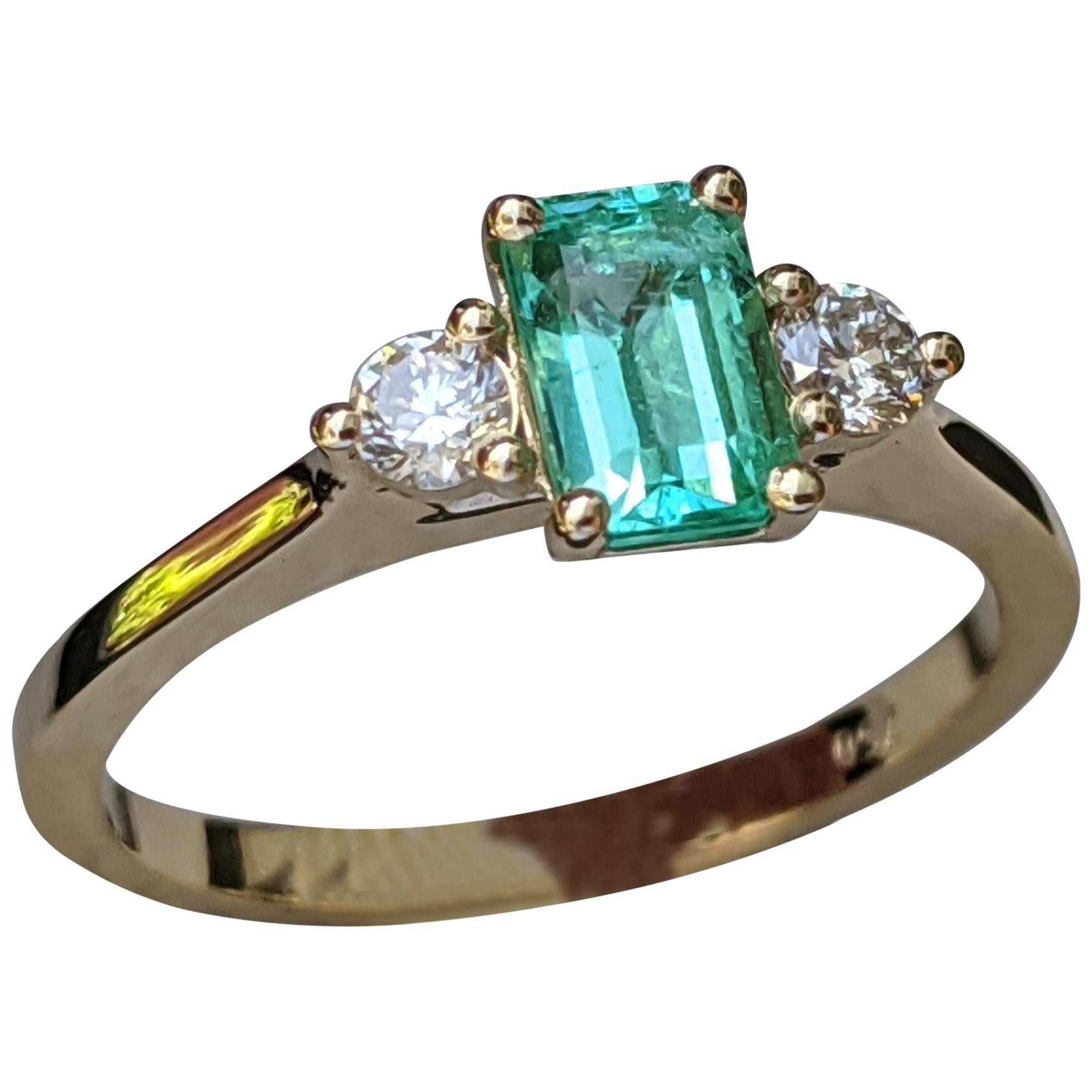 0.8 Carat 14 Karat Yellow Gold Emerald and Diamond 3-Stone Engagement Ring