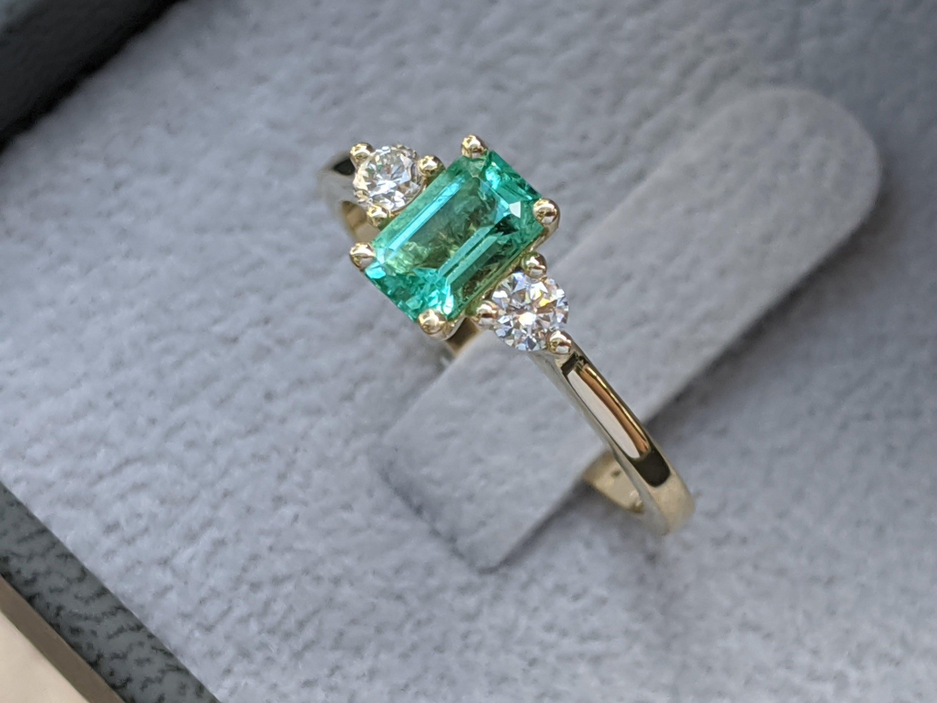 3 Stone Emerald Ring, Emerald And Diamonds Engagement Ring, Trilogy Ring, Yellow Gold Promise Ring, Anniversary Gift, Natural Green Emerald
 
 Main Stone Name: Emerald Cut Natural Emerald
 Main Stone Weight: 0.60ct.
 Main Stone Clarity: Eye Clean
