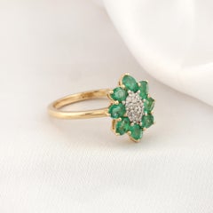 0.8 Carat Oval Zambian Emerald 0.13 Carat SI/H Diamond Ring 14 Karat Yellow Gold