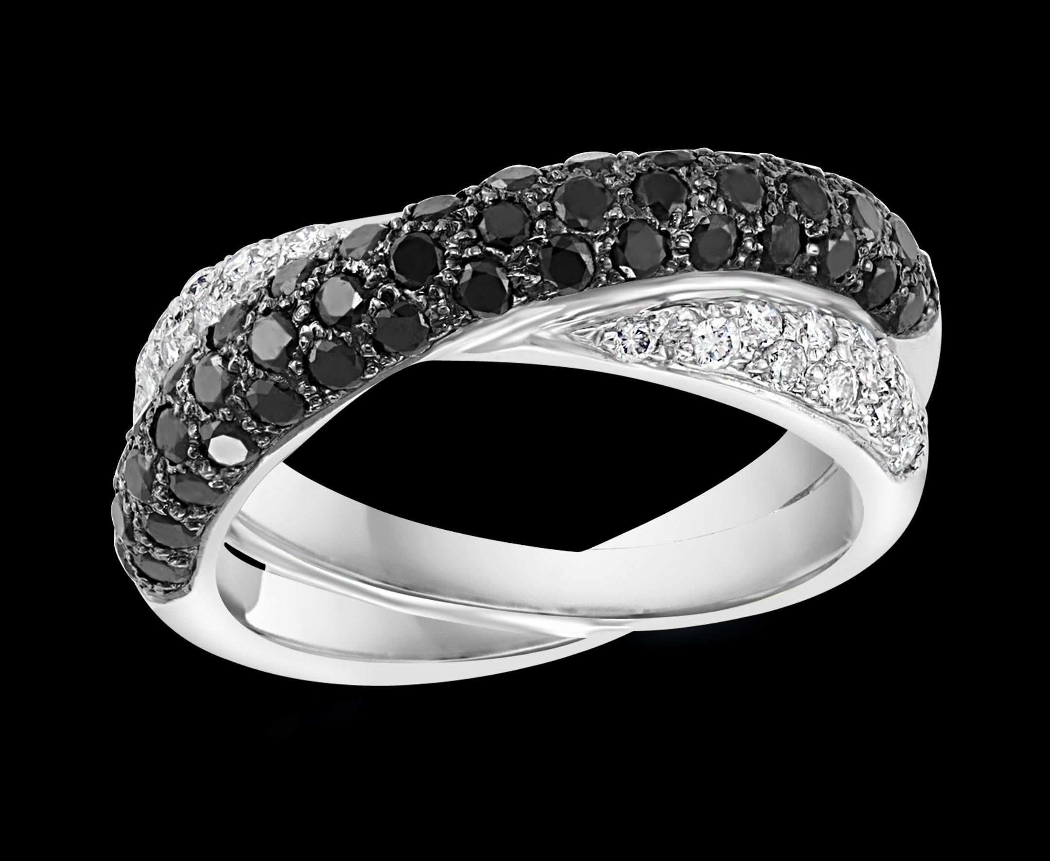 0.8 Ct Black & 0.7 Ct White  Diamond  Cross Over Band 18 Karat White Gold 
Diamond weights are approximate.
Diamond VS quality and G/H color
Very clean and shiny diamonds.
This Half eternity band features one row of white diamonds and one row of