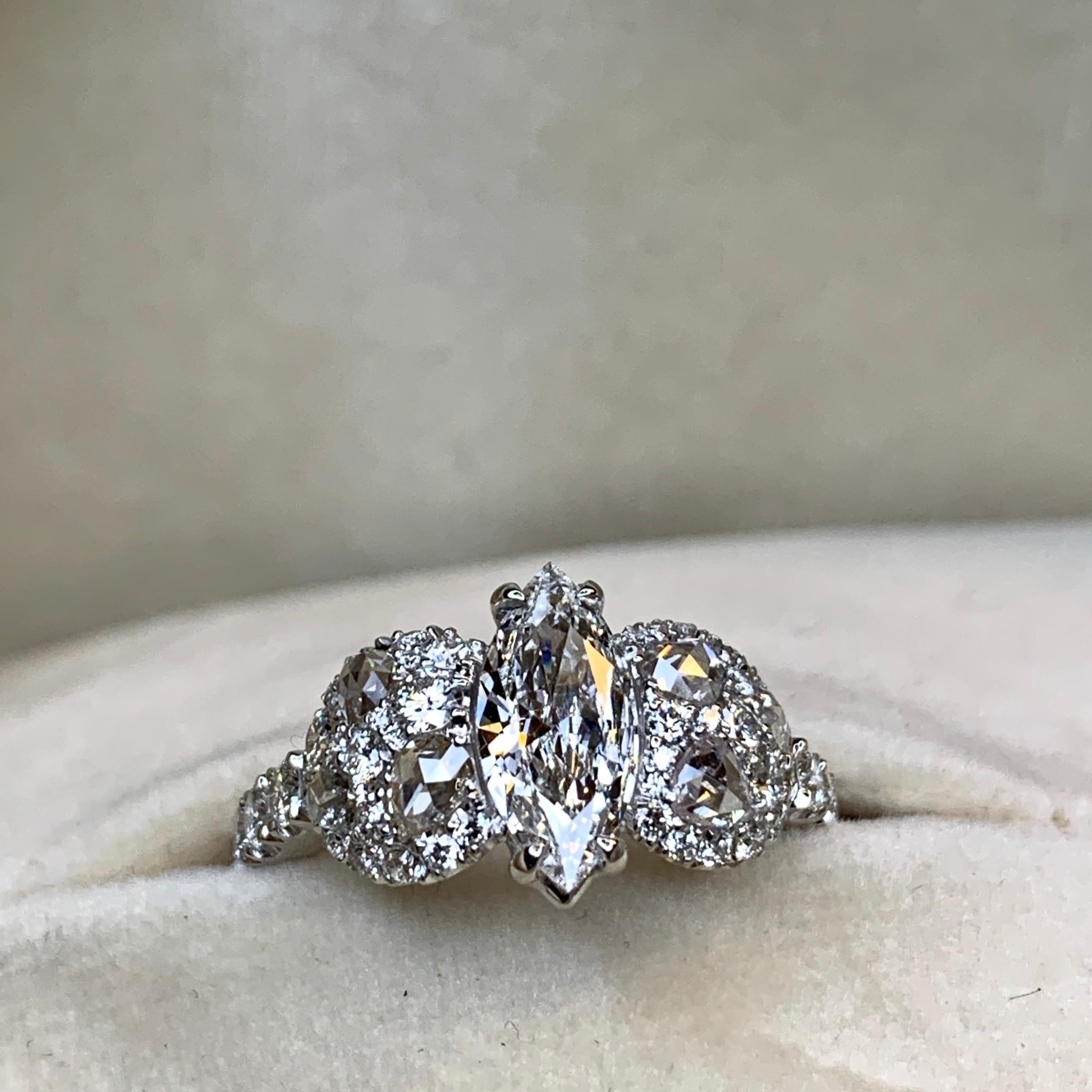 One of a kind ring handmade in Belgium by jewellery artist Joke Quick,  in 18K white gold 7,9 g. 

Set with a HRD Certified E LC  0,80 ct. Marquise shape diamond centerstone, 
pave set white DEGVVS brilliant-cut diamonds 0,86 ct. 
white rose-cut