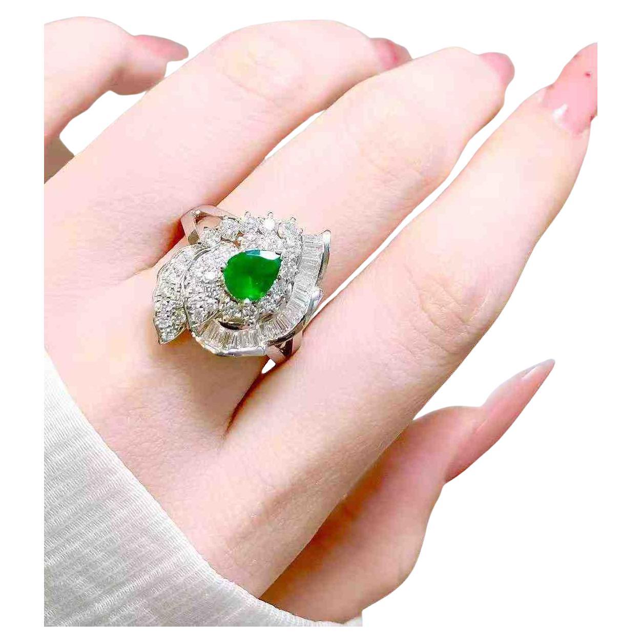 0.80 Carat Emerald and 1.20 Carat Diamond Halo Ring in 18K White Gold For Sale