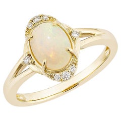 0.80 Carat Ethiopian Opal Fancy Ring in 14Karat Yellow Gold with White Diamond.