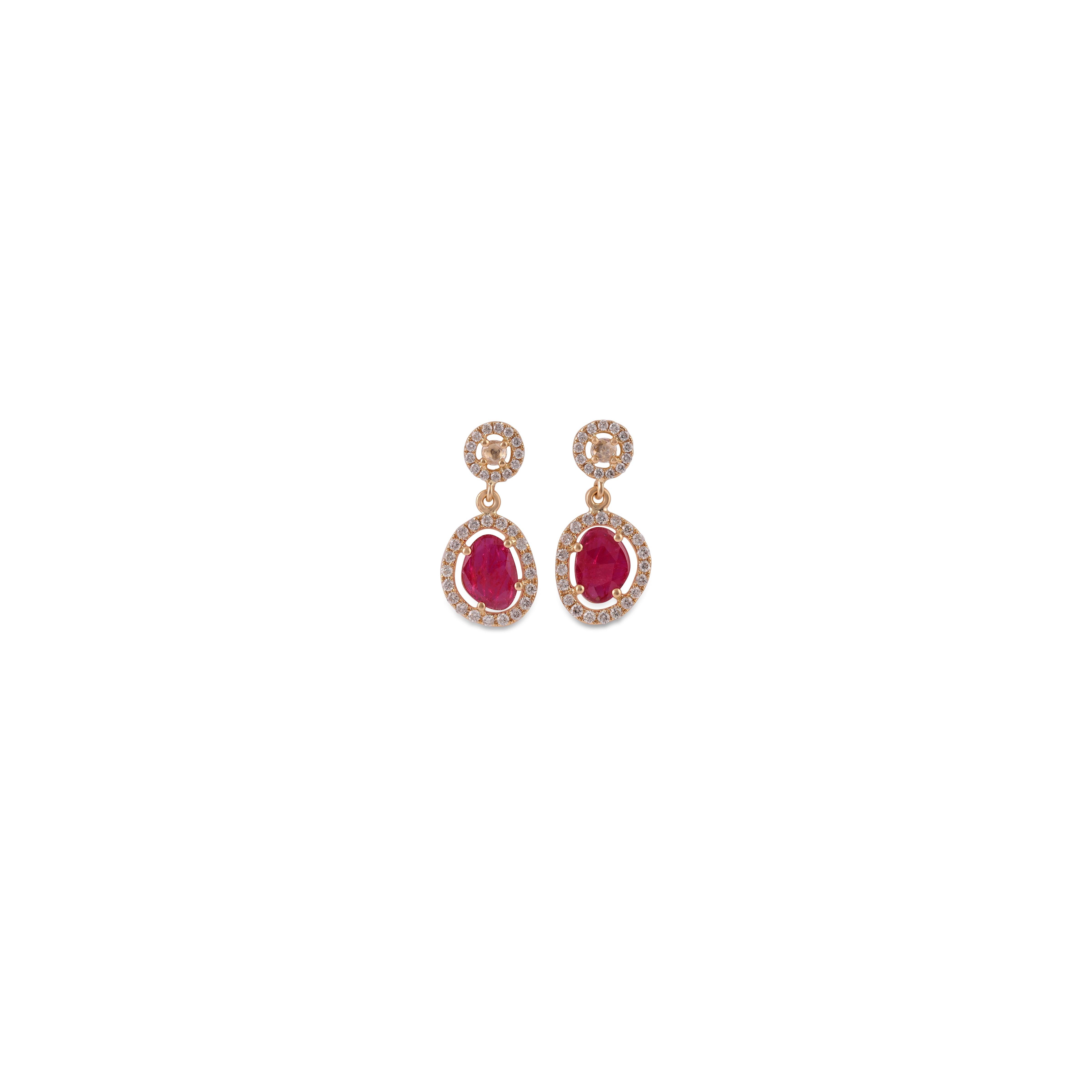 An exclusive pair of earrings with rose cut  Ruby 0.80 carat in the cluster with a round-shaped diamond 0.50 carat studded in 18K Yellow gold 2.78 grams with a simple pull-push mechanism. These are elegant & wearable earrings.

