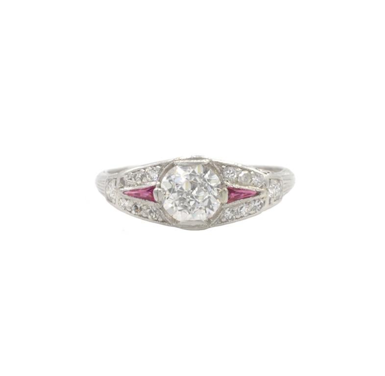 Art Deco diamond and ruby platinum ring from circa 1930s.  This beautiful ring features a center 0.80 carat Old European Cut diamond that is G in color and VS2 in clarity (per EGL certificate).  Surrounding the center diamond are 12 single cut