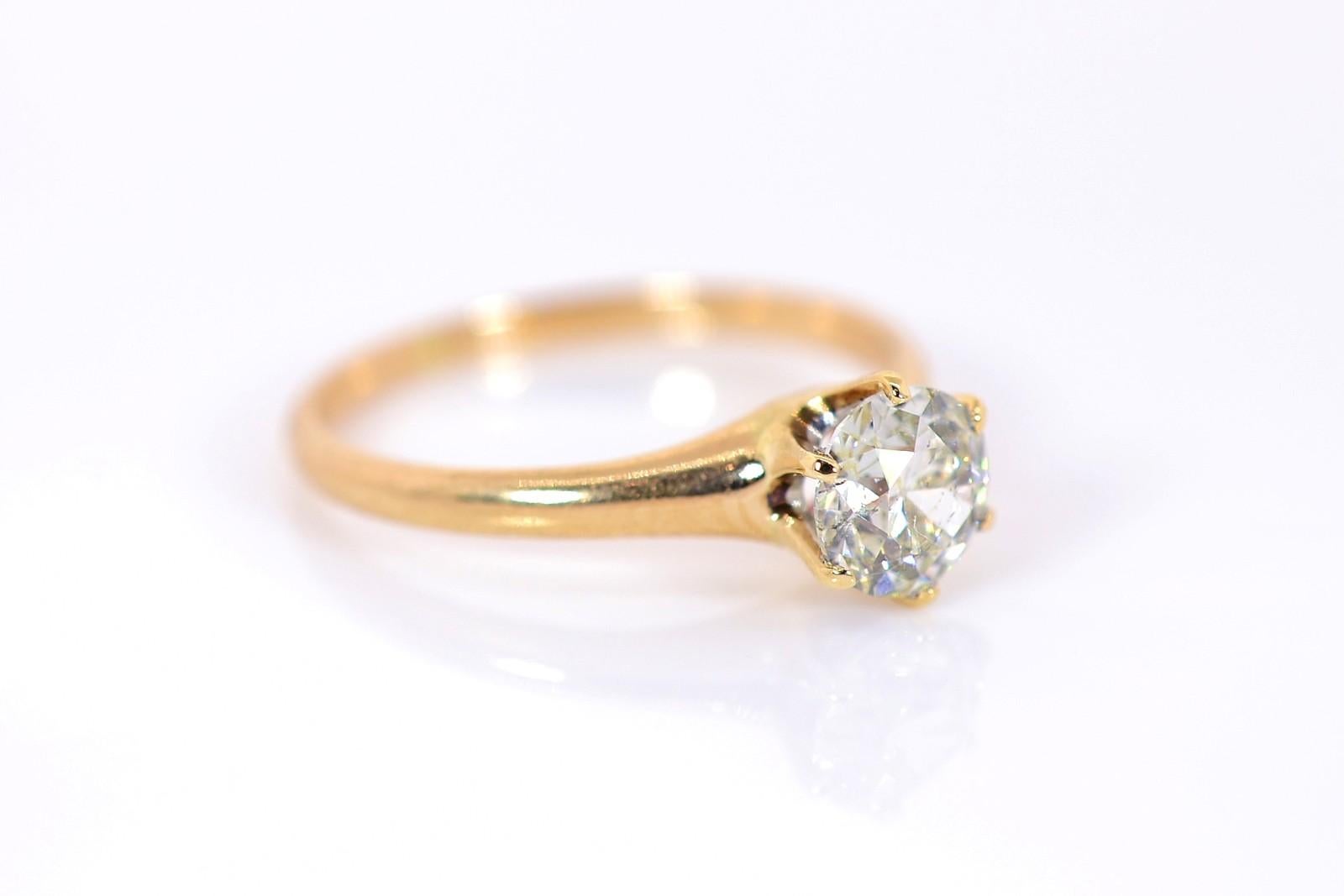 The quintessential engagement ring.  This 1920's 14KT yellow gold ring showcases a gorgeous 0.80 carat Old European cut Diamond of I color - SI3 clarity.  The six prong setting is lined with platinum under the diamond, an extra high quality detail