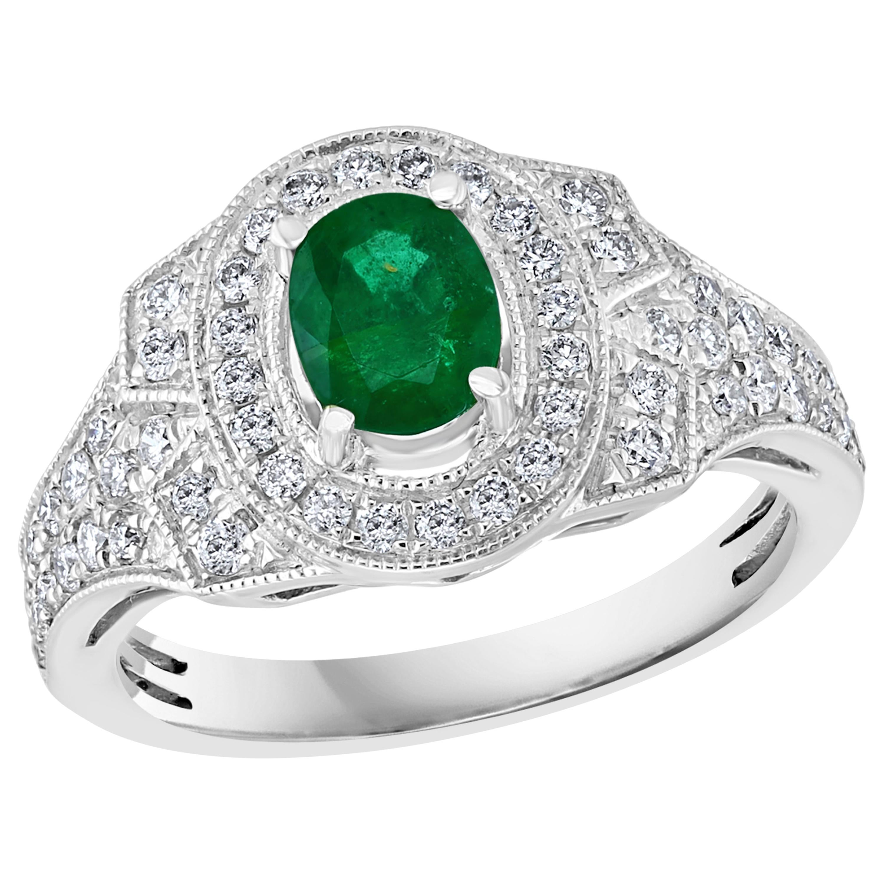 0.80 Carat Oval Cut Emerald and 0.85 Carat Diamond Ring 18 Karat White Gold