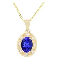 0.80 Carat Oval Shaped Tanzanite and 0.04 Carat White Diamond Pendant 0.80 Carat Oval Shaped Tanzanite and 0.04 Carat White Diamond Pendant