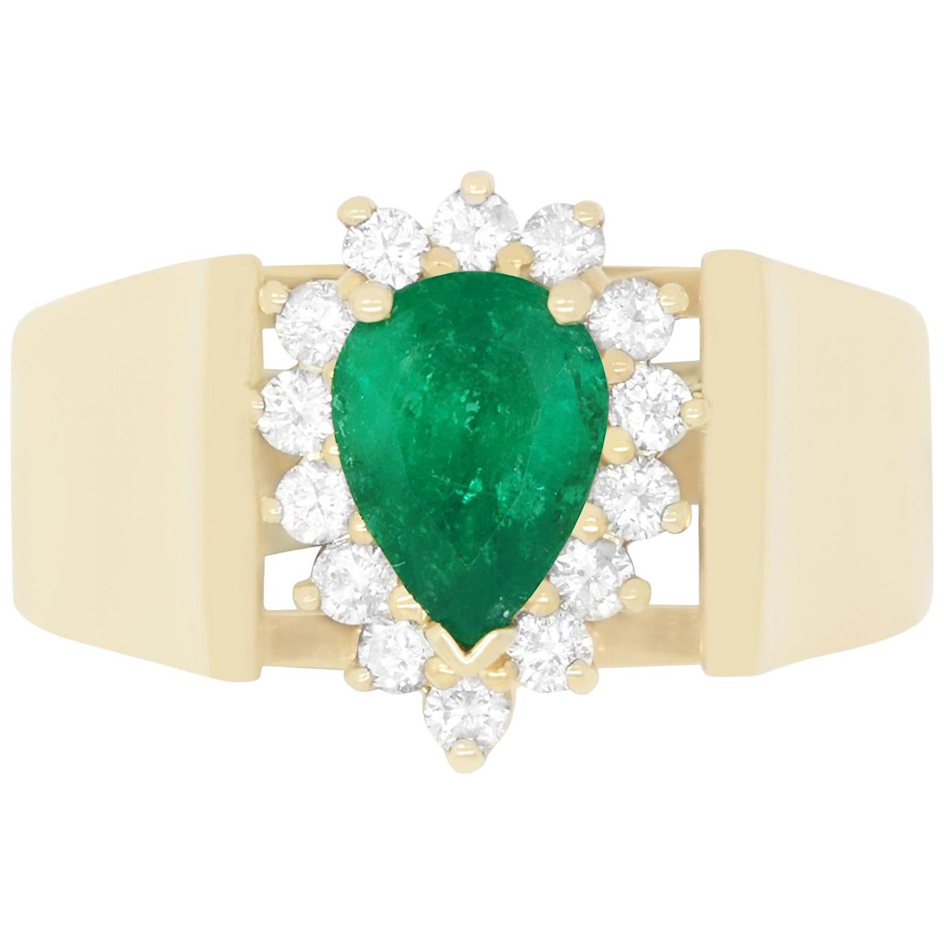 0.80 Carat Pear Shaped Emerald and 0.26 Carat White Diamond Ring
