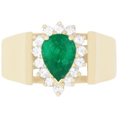 0.80 Carat Pear Shaped Emerald and 0.26 Carat White Diamond Ring