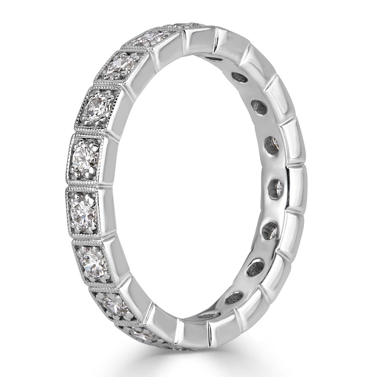 This gorgeous diamond eternity band showcases 0.80ct of round brilliant cut diamonds graded at E-F in color, VS1-VS2 in clarity, measuring at 2.9mm. The diamonds are each accented with exquisite milgrain detail throughout and set in a vintage, 18k