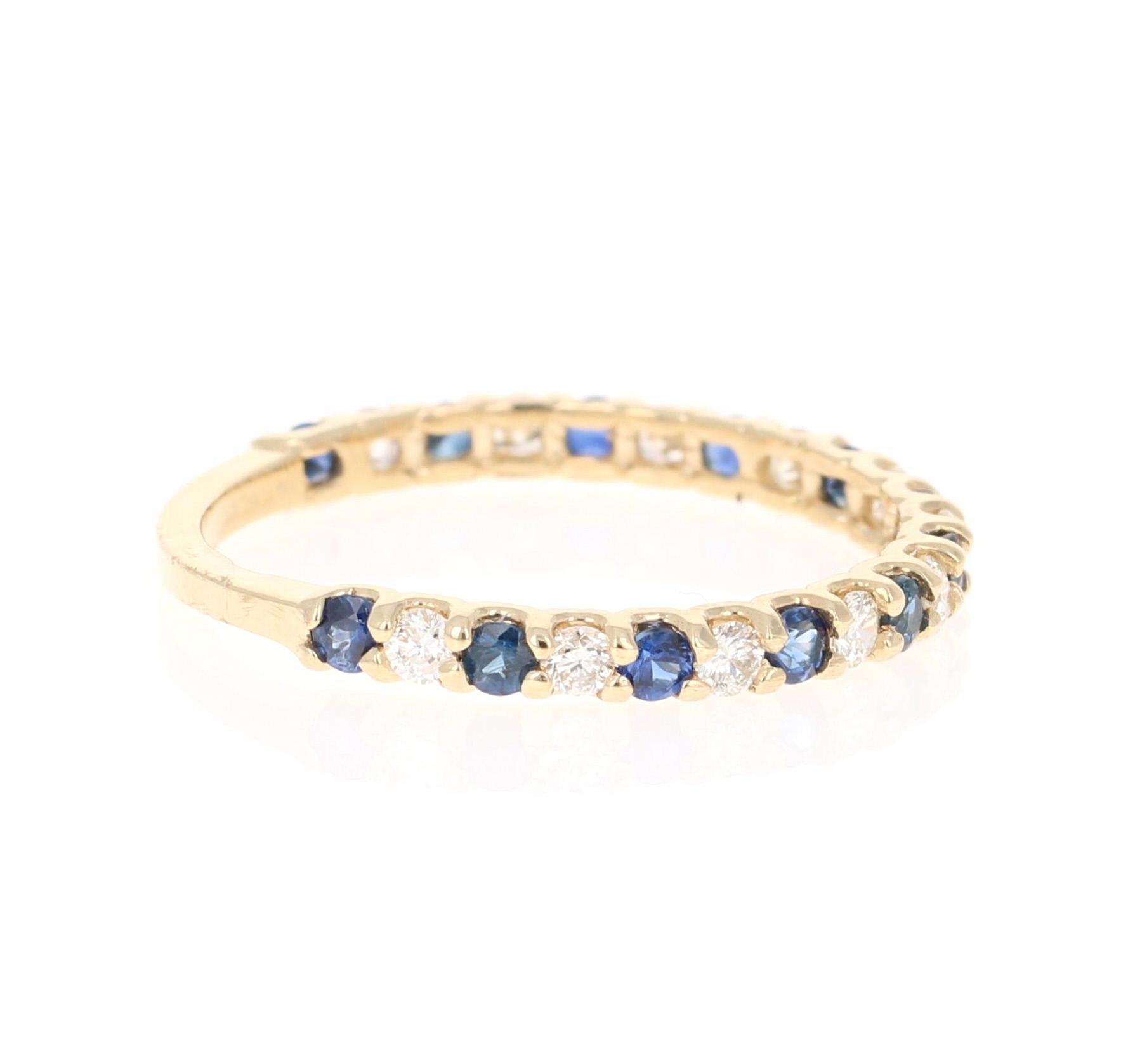 Cute and dainty Sapphire and Diamond band that is sure to be a great addition to anyone's collection.   

There are 11 Round Cut Sapphires that weigh 0.48 carats and 12 Round Cut Diamonds that weigh 0.32 carats (Clarity: SI, Color: F).  The total