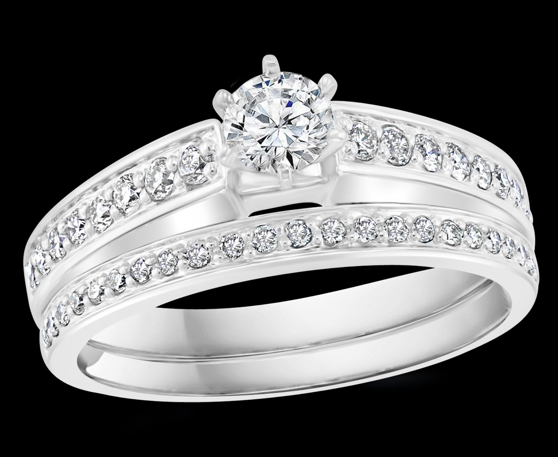 0.8 Carat  Total Diamond weight with 0.20 carat Solitaire Round Center Diamond Engagement 14 White Gold Ring + Band
Prong set
14 K gold Stamped 
Diamond VS2 quality and G color.
Very Clean diamonds.
Round brilliant cut diamonds are on either side of