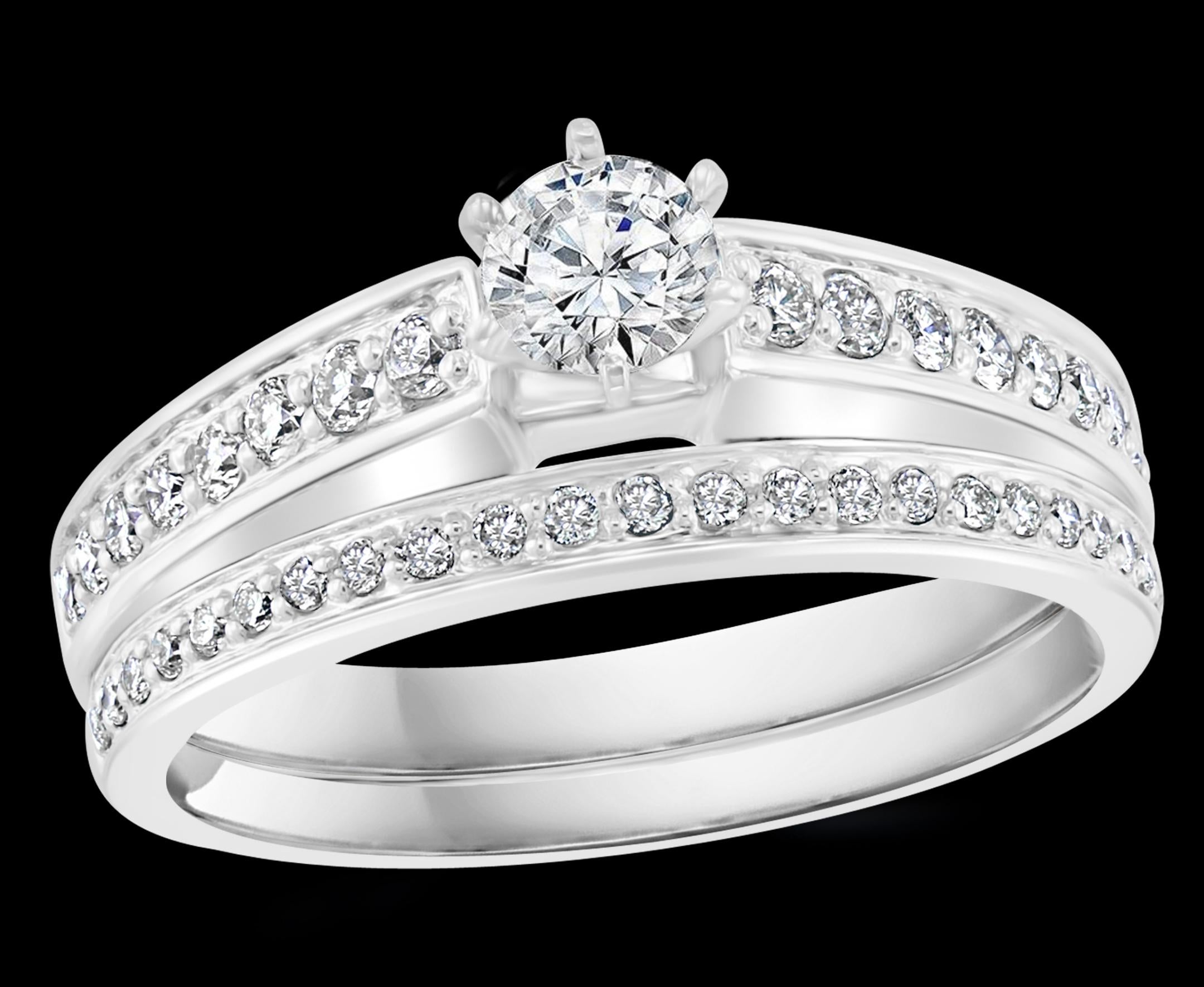 0,8 Carati  Peso totale del diamante con 0,20 carati di diamante centrale solitario di fidanzamento in oro bianco 14 + cinturino
Set di punte
Oro 14 K stampato 
Diamante di qualità VS2 e colore G.
Diamanti molto puliti.
I diamanti rotondi a taglio