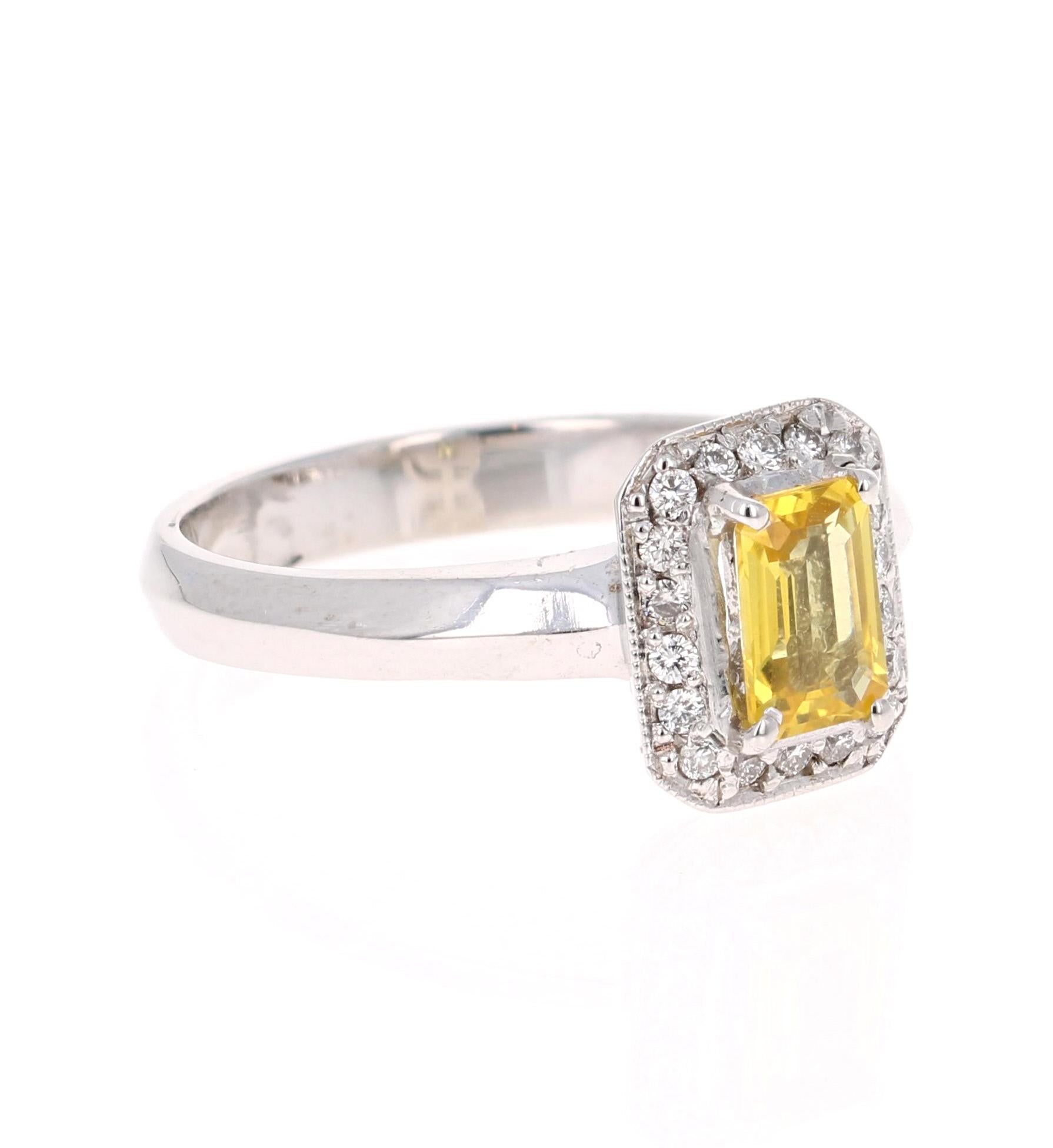 This cute ring has a Emerald Cut Yellow Sapphire that weighs 0.66 Carats and is surrounded by 18 Round Cut Diamonds that weigh 0.14 Carats. The total carat weight of the ring is 0.80 Carats. 

The ring is set in a cute 14 Karat White Gold setting,