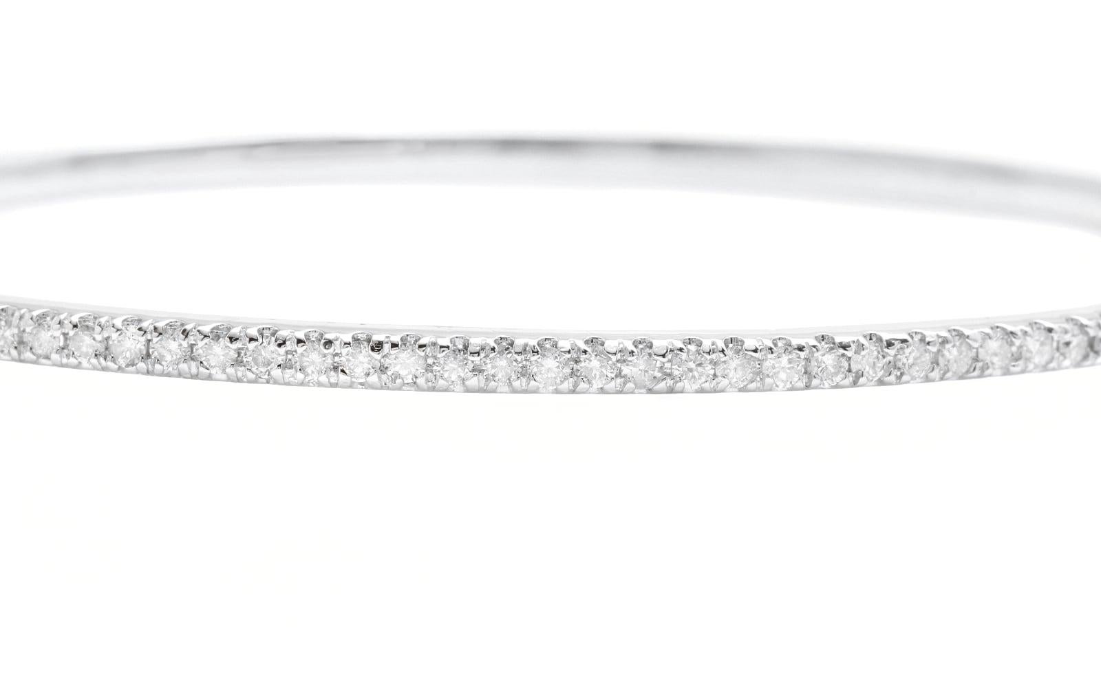Very Impressive 0.80 Carats Natural Diamond 14K Solid White Gold Bangle Bracelet 

Suggested Replacement Value: Approx. $6,000.00

STAMPED: 14K

Total Natural Round Diamonds Weight: Approx. 0.80 Carats (color G-H / Clarity SI1-SI2)

Bangle Wrist