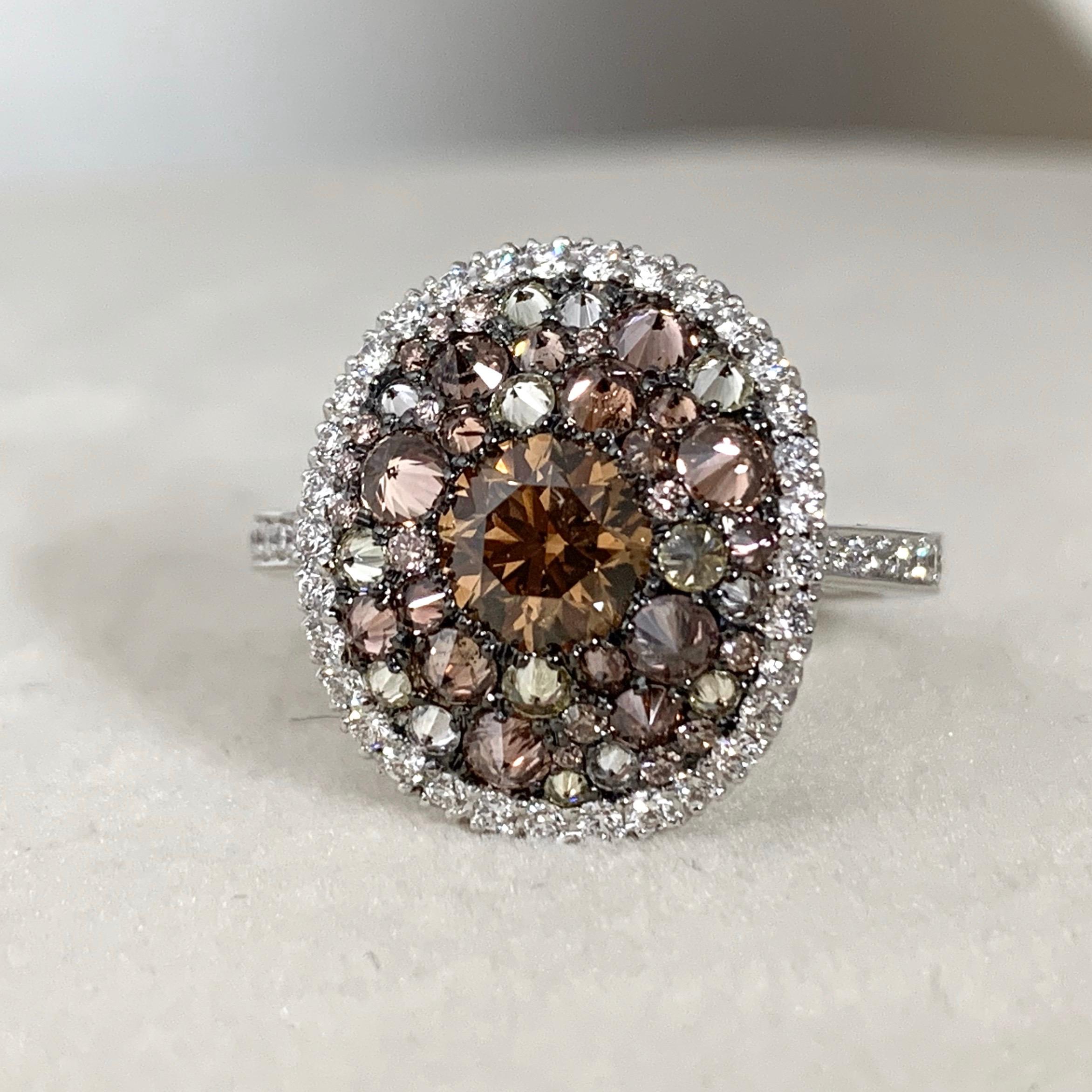 One of a kind ring made in Belgium by jewellery artist Joke Quick in 18K White gold 7,4 g set with a 0,80 Ct. Argyle Certified Brown Diamond. Mix of Upside down and regular pave set:  Fancy chocolate pink brilliant-cut diamonds 0,85 ct., Fancy lemon
