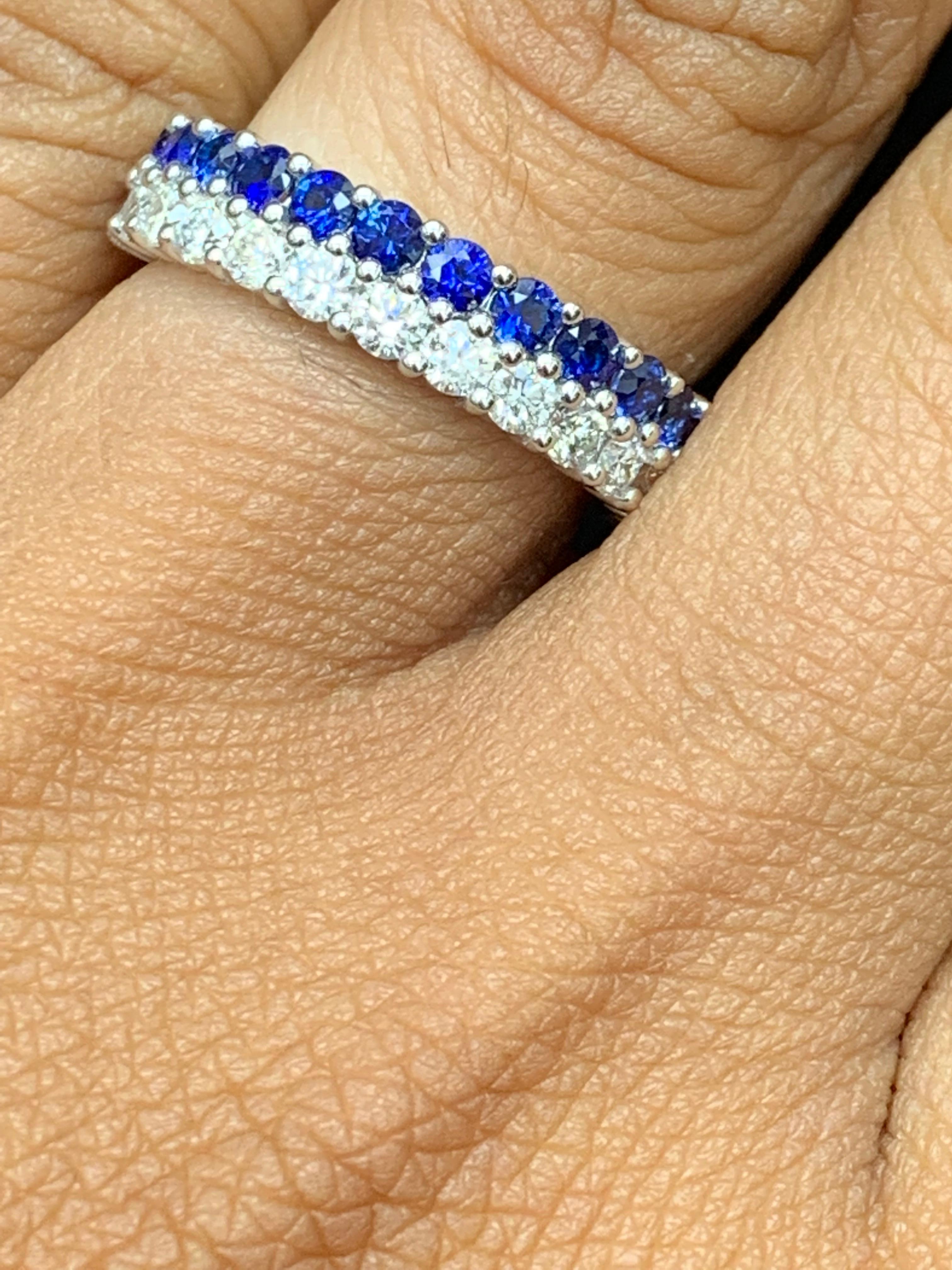 A unique and fashionable ring showcasing two rows of round-shape 13 blue sapphires and 14 diamonds, set in a band design. Emeralds weigh 0.80 carats and Diamonds weigh 0.70 carats total. A brilliant and masterfully-made piece.

Style available in