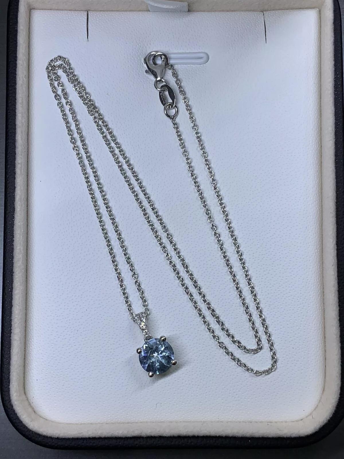 Women's or Men's 0.80ct Aquamarine and diamond halo pendant necklace in 18k white gold. For Sale